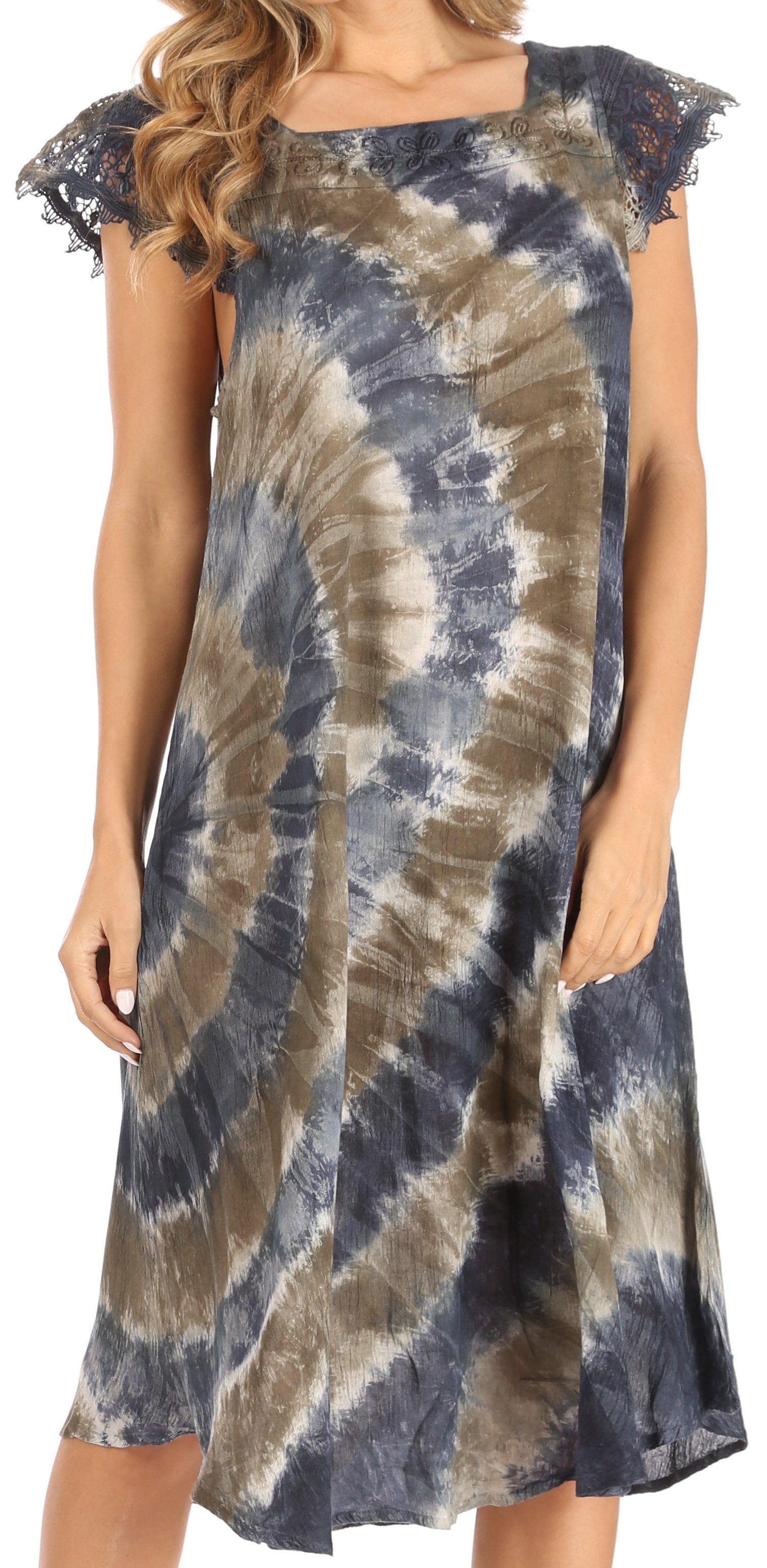 Woman wearing a tie-dye dress with lace sleeves.