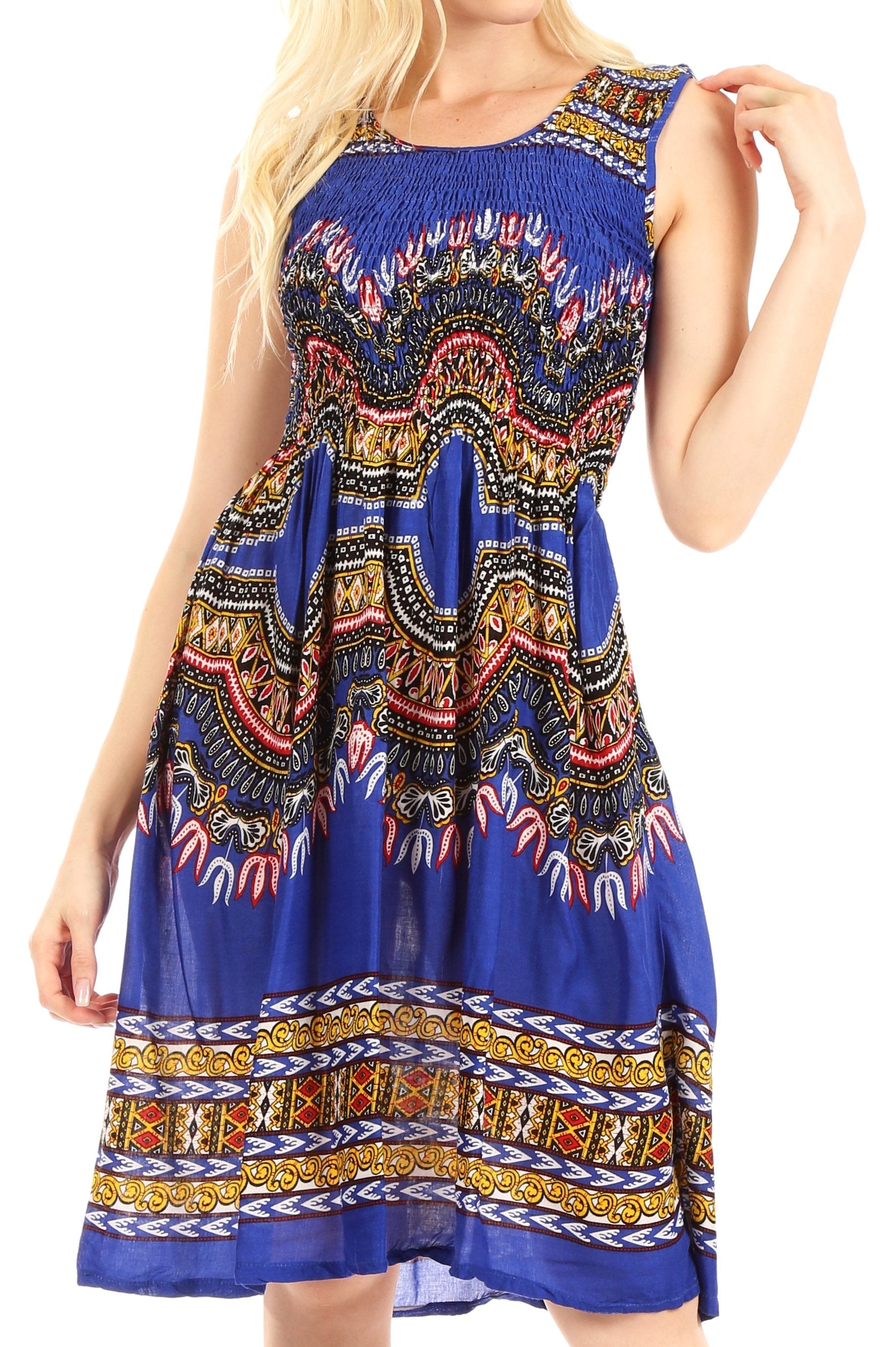 Woman wearing a blue dress with colorful pattern on a white background