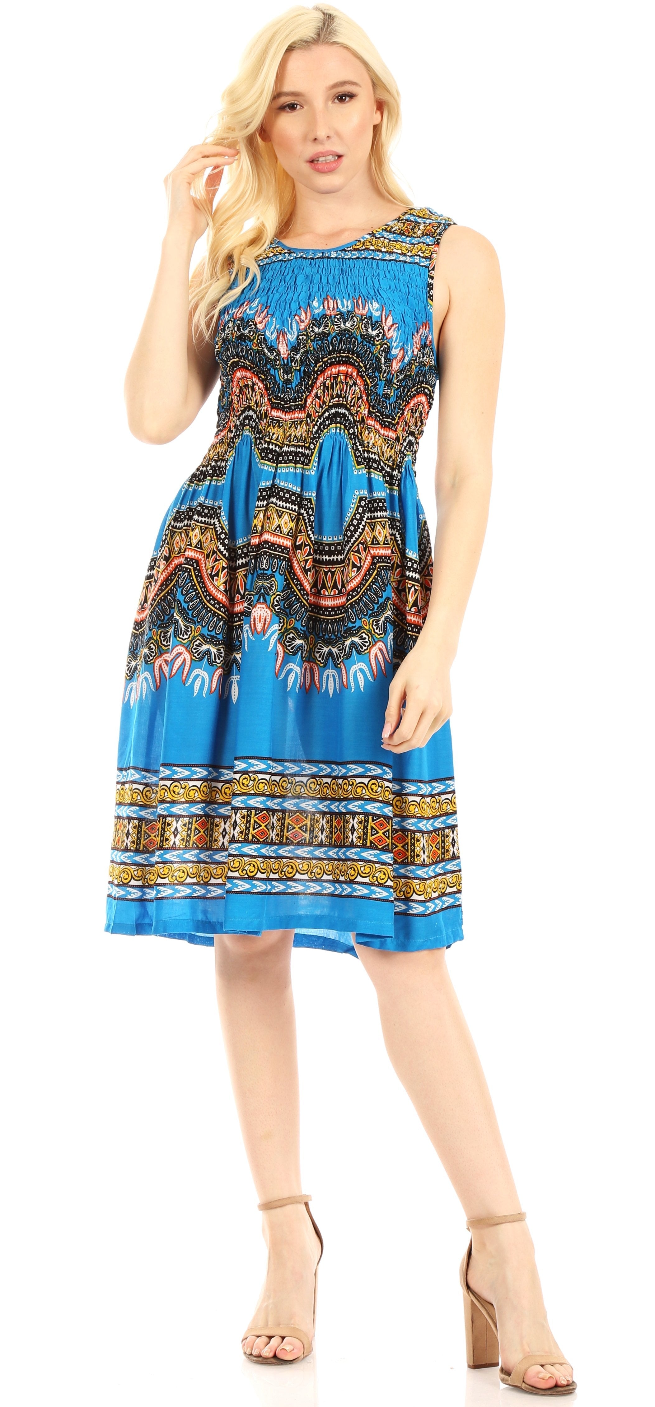 Woman wearing a blue patterned dress on a white background