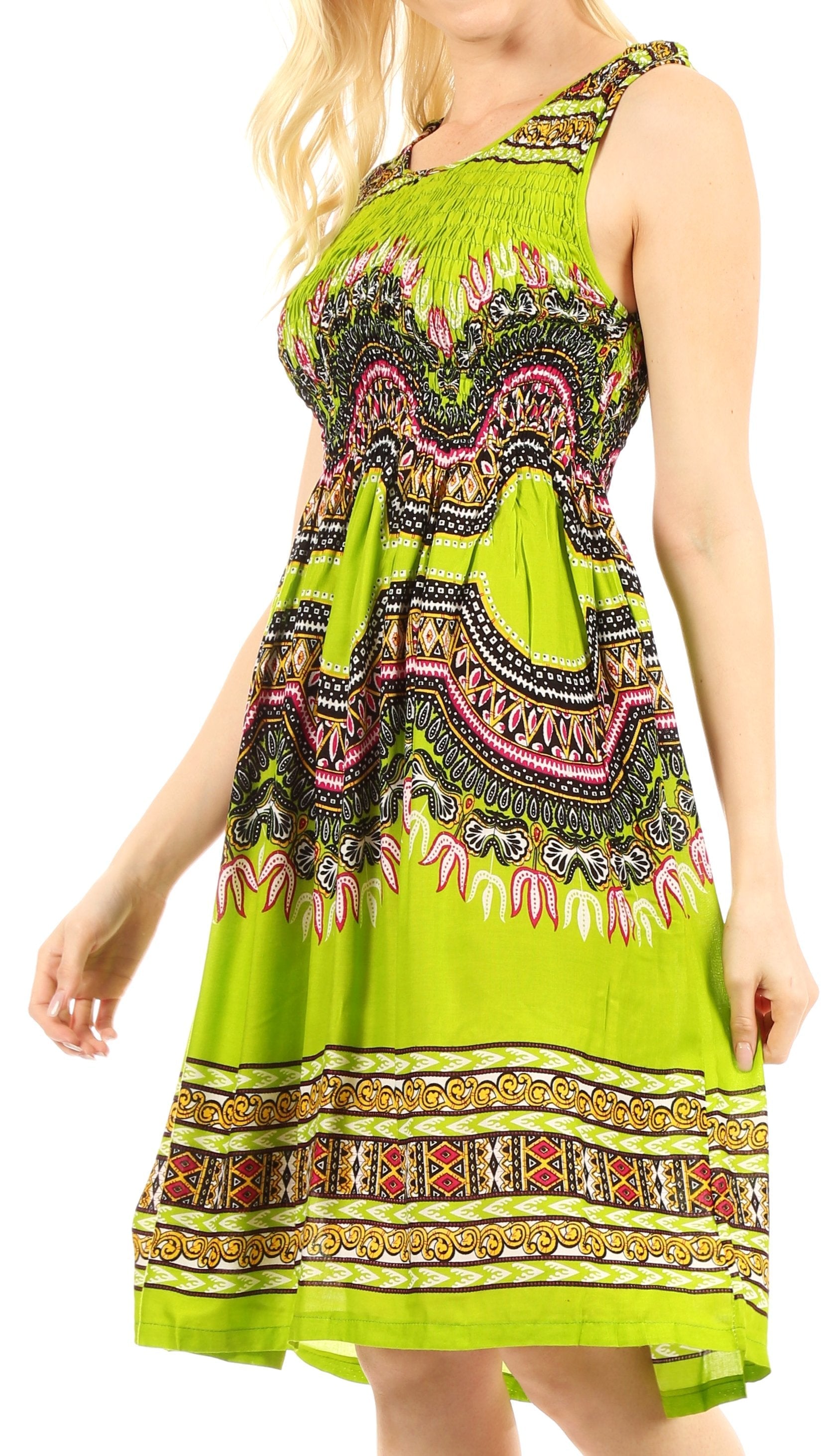Woman wearing a bright green dress with intricate patterns on a white background
