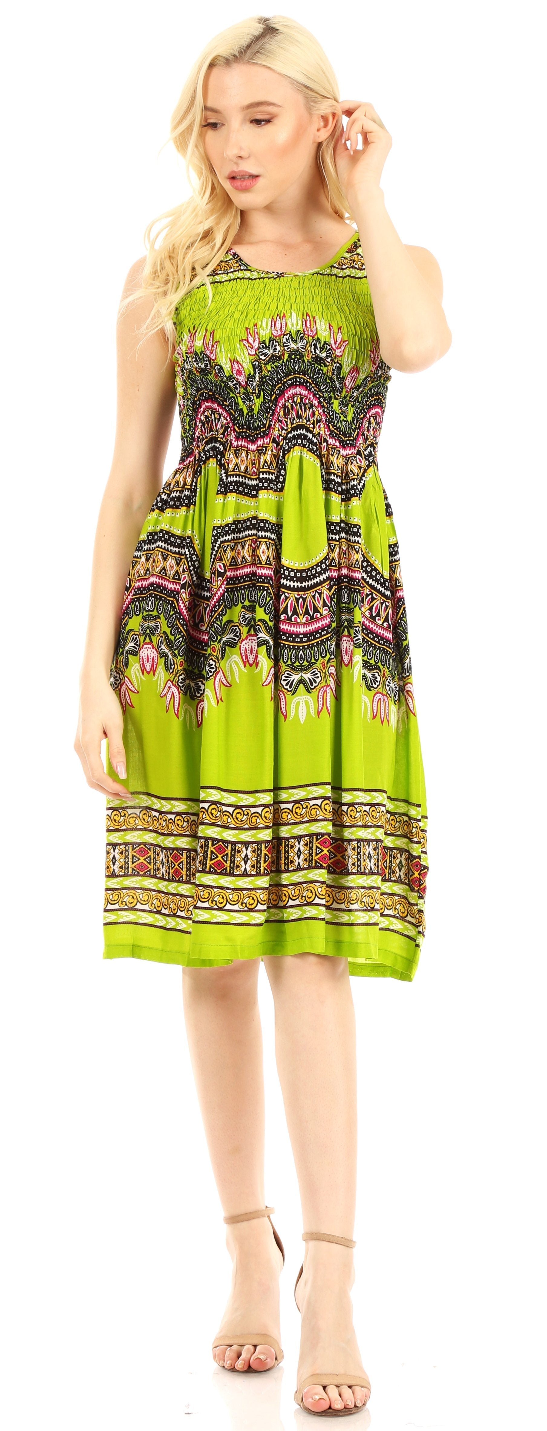 Woman wearing a green patterned dress on a white background