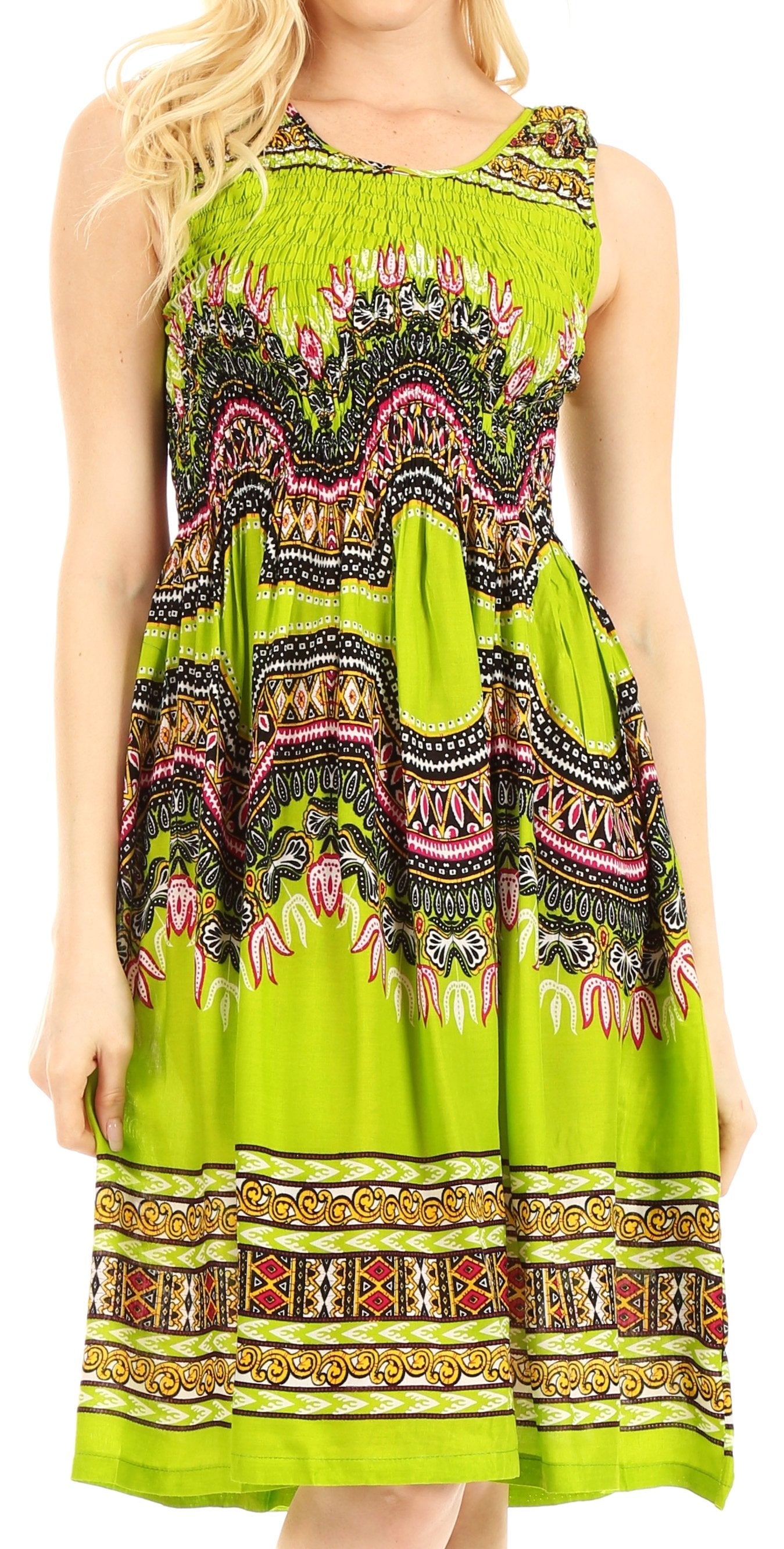 Woman wearing a bright green dress with colorful pattern on a white background