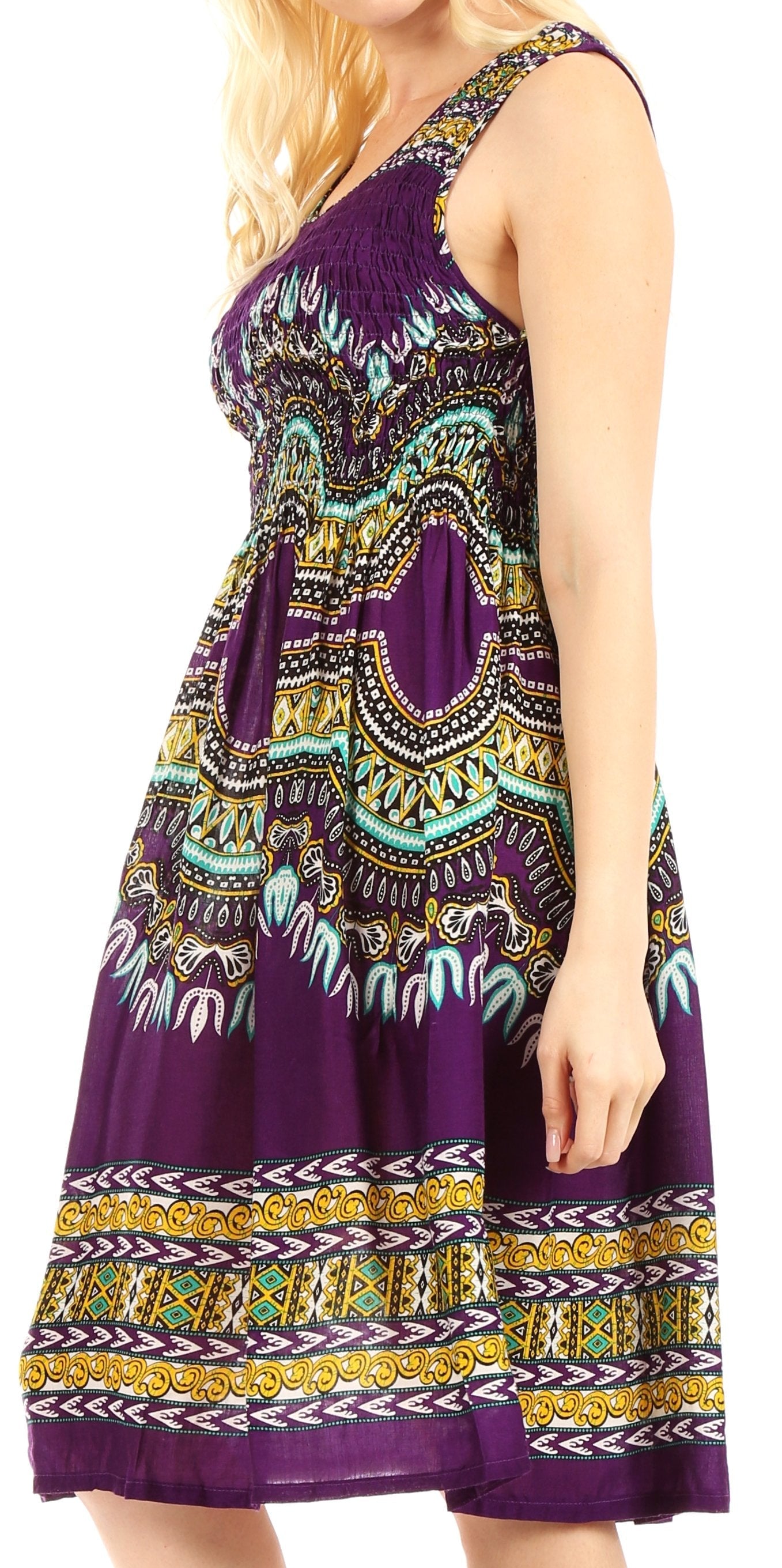 Woman wearing a purple dress with colorful patterns on a white background