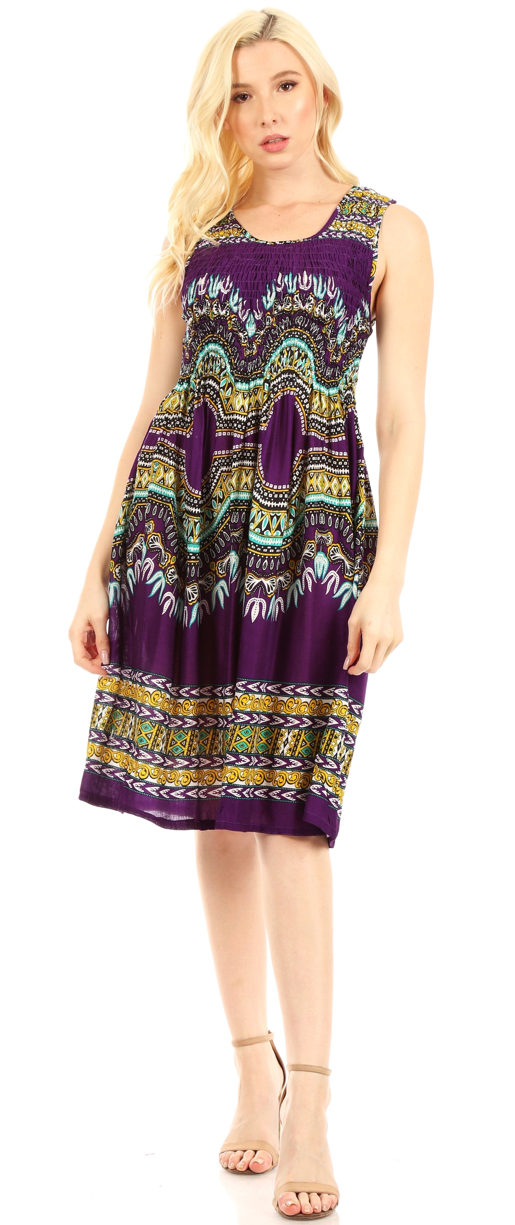 Woman wearing a purple patterned dress on a white background
