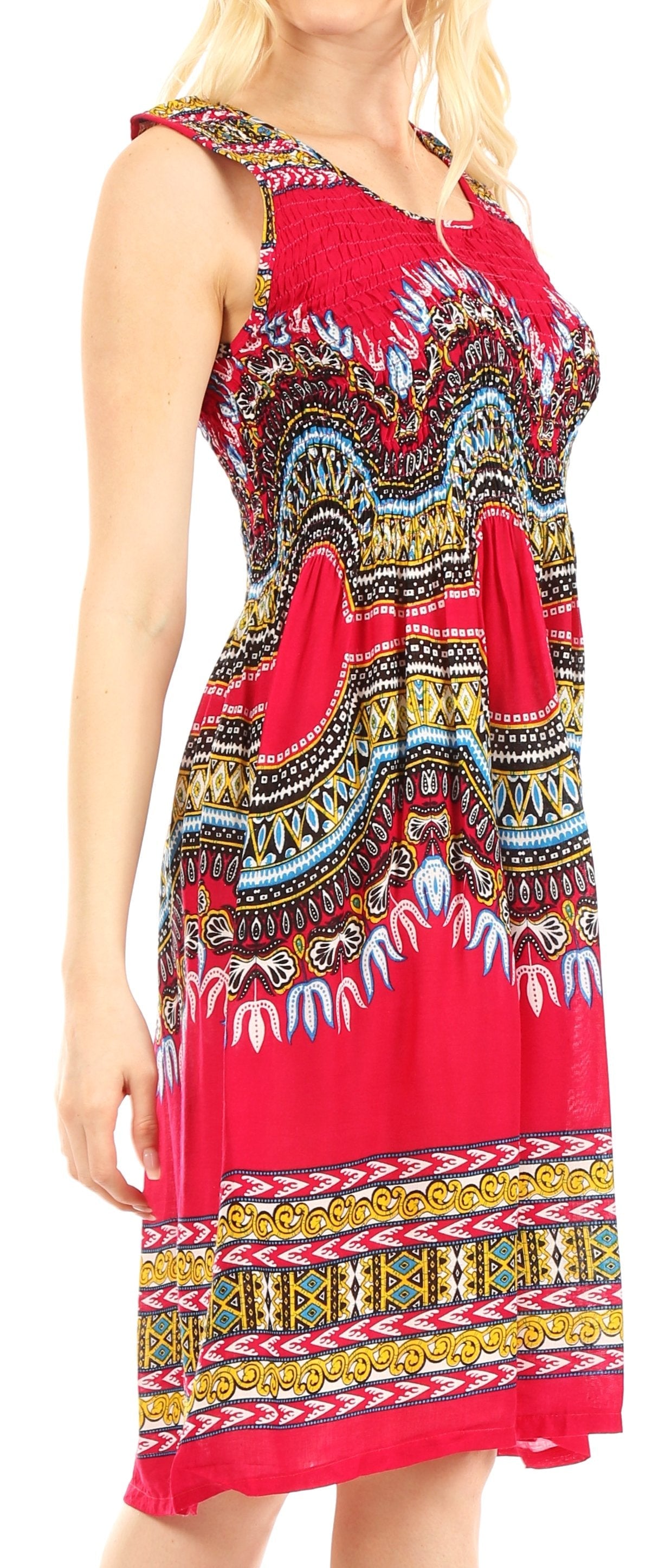 Woman wearing a colorful patterned dress with a red background
