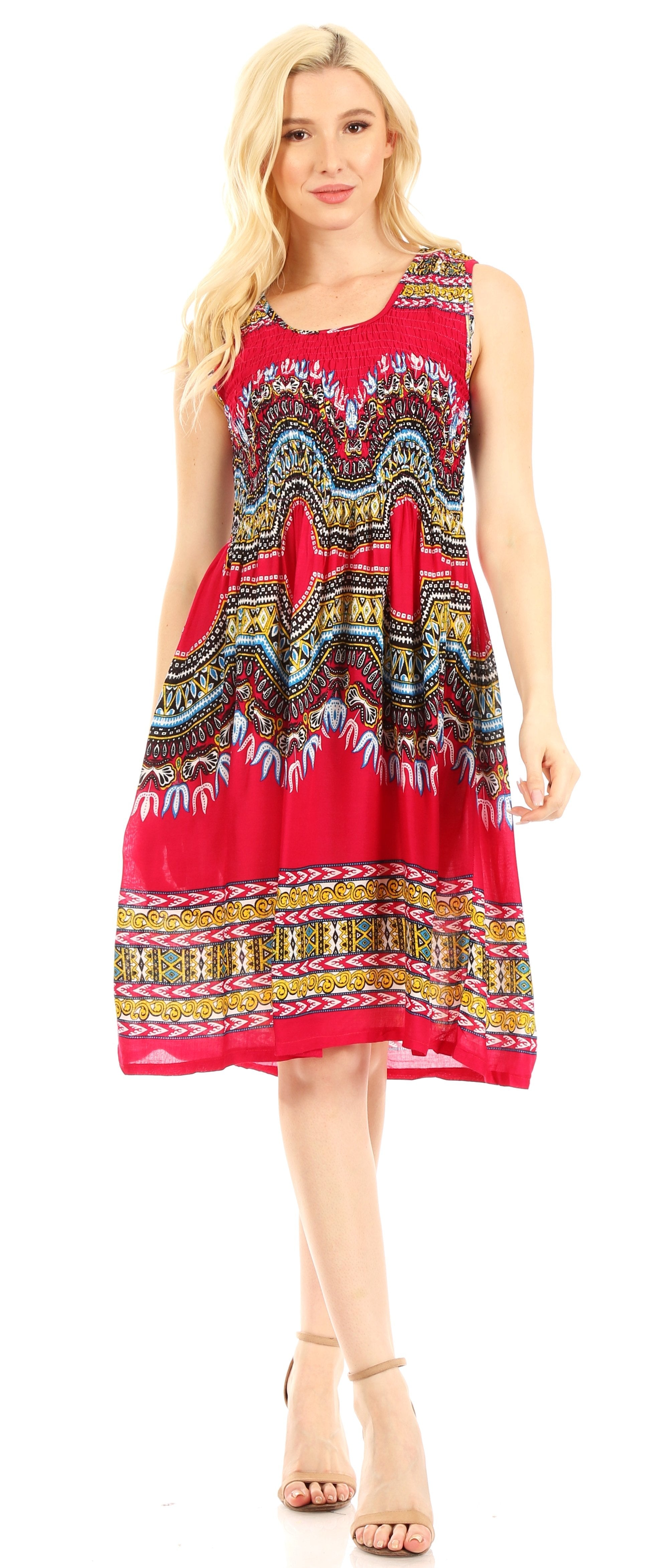 Woman wearing a red dress with a colorful pattern on a white background