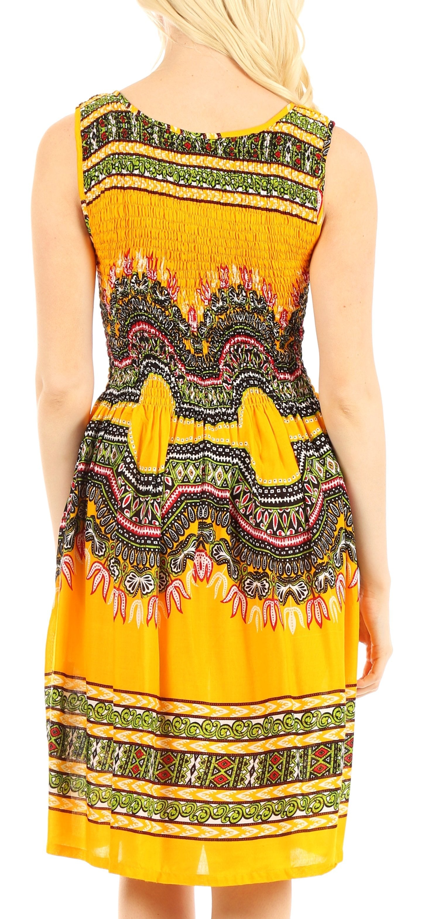 Woman wearing a yellow dress with a colorful pattern