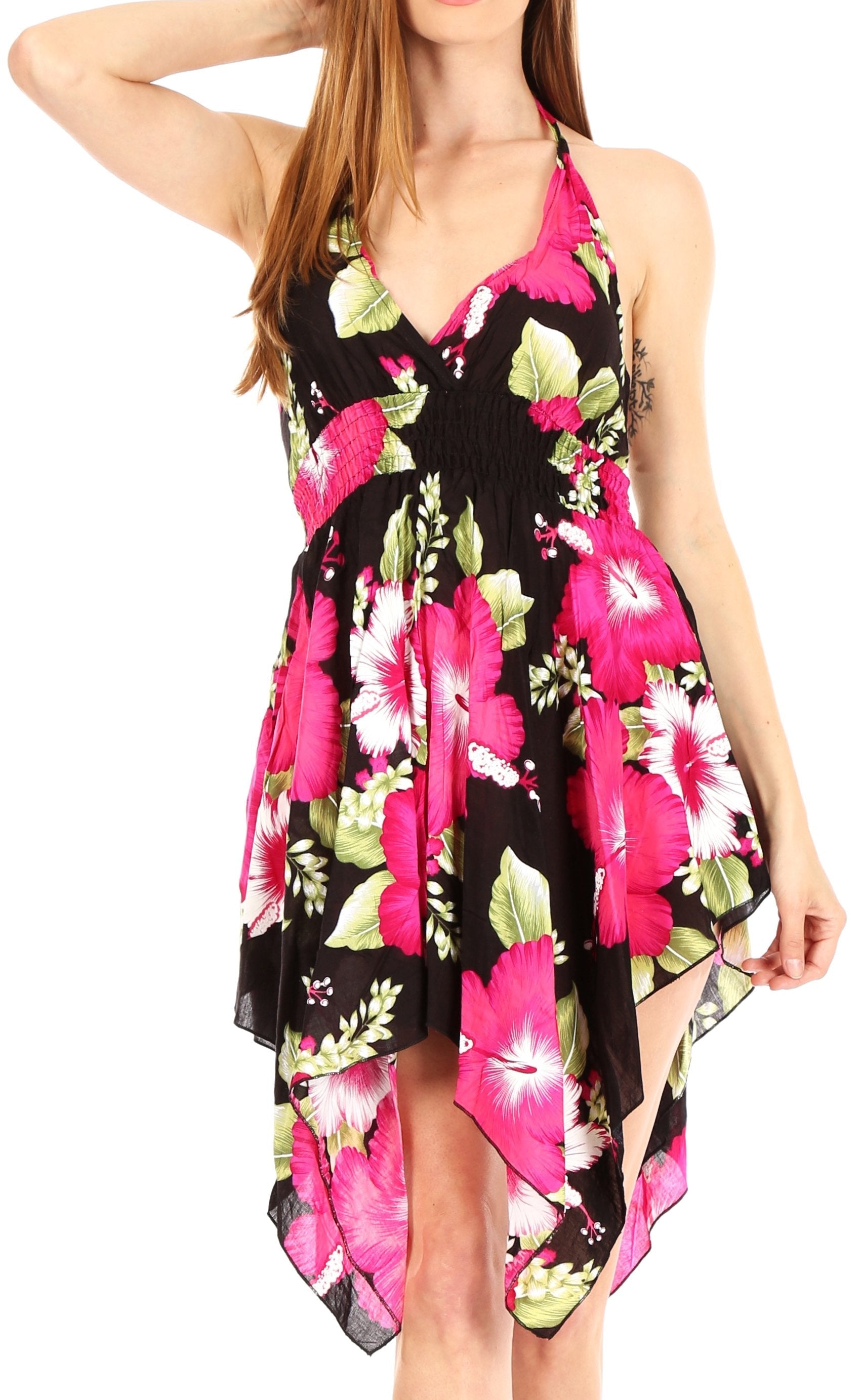 Woman wearing a floral dress with pink and green flowers on a black background