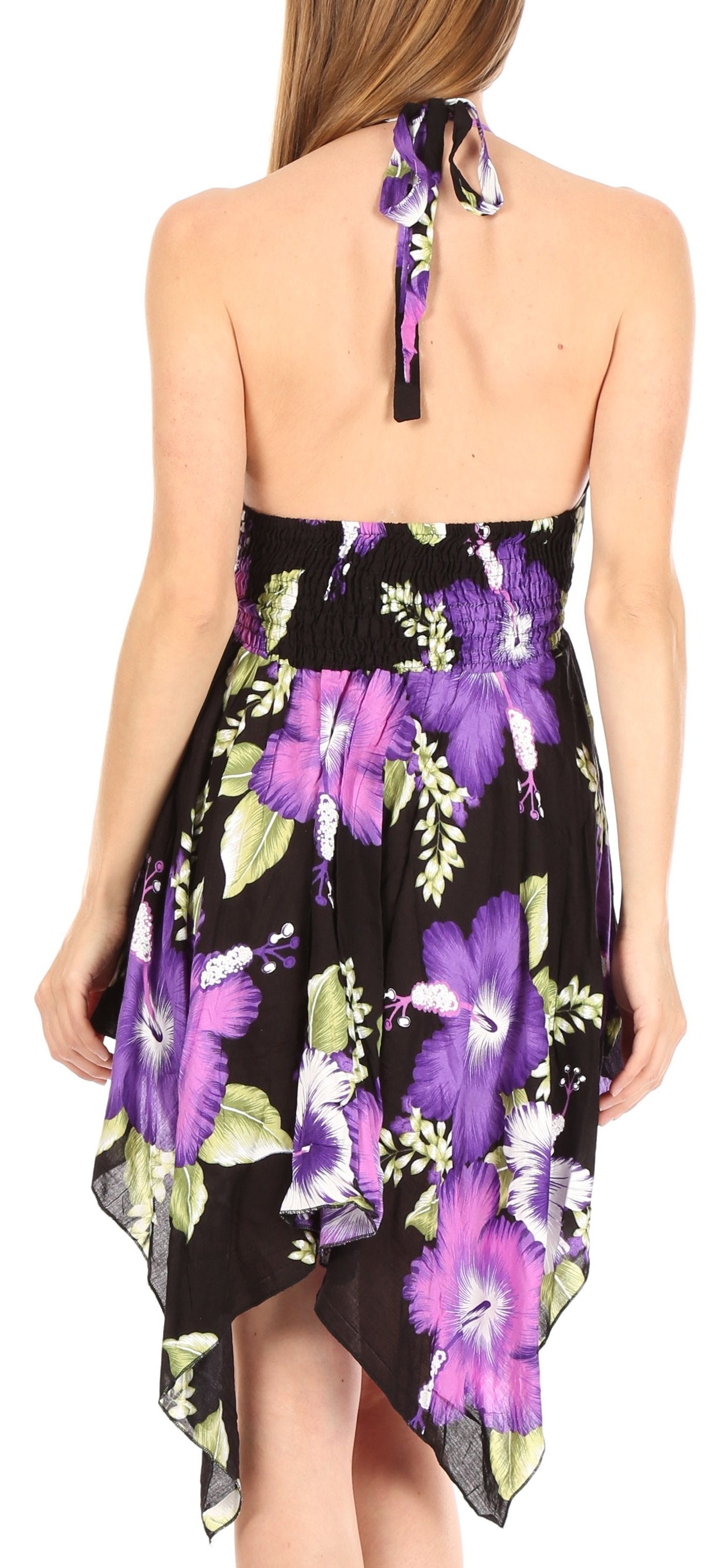 Woman wearing a floral dress with purple flowers on a white background