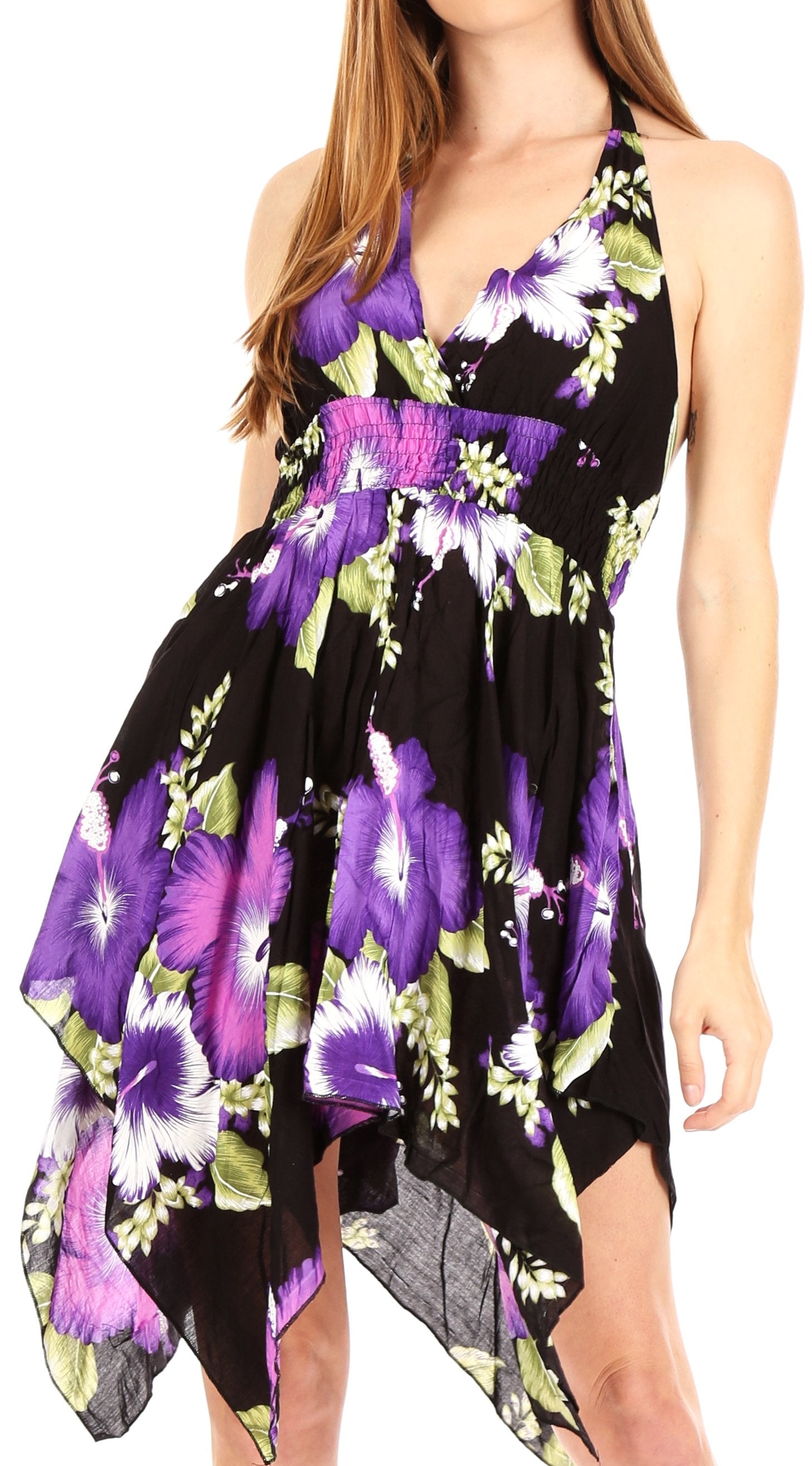 Woman wearing a floral dress with purple flowers on a black background