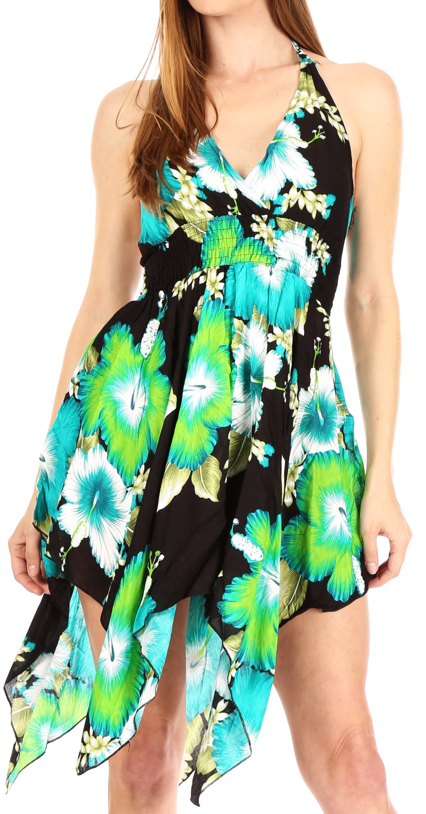 Woman wearing a floral dress with green and blue flowers on a black background