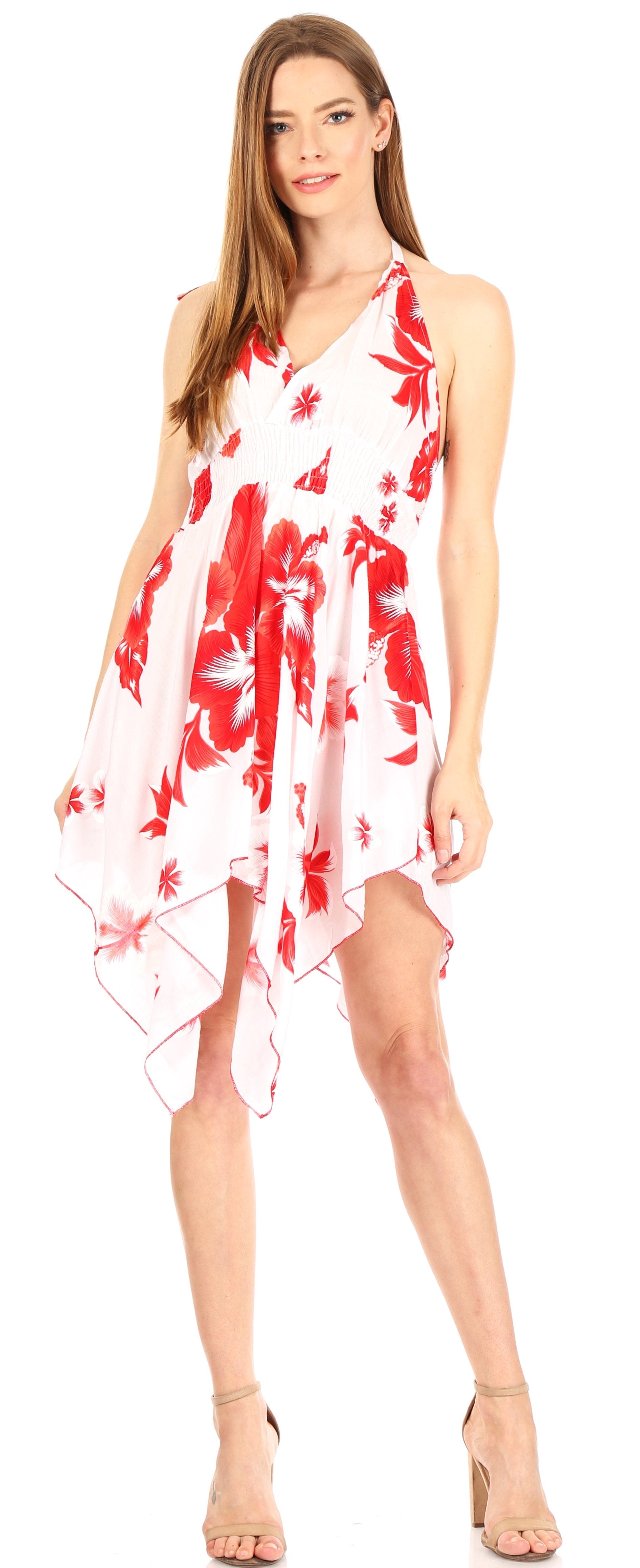 Woman wearing a white dress with red floral patterns on a white background