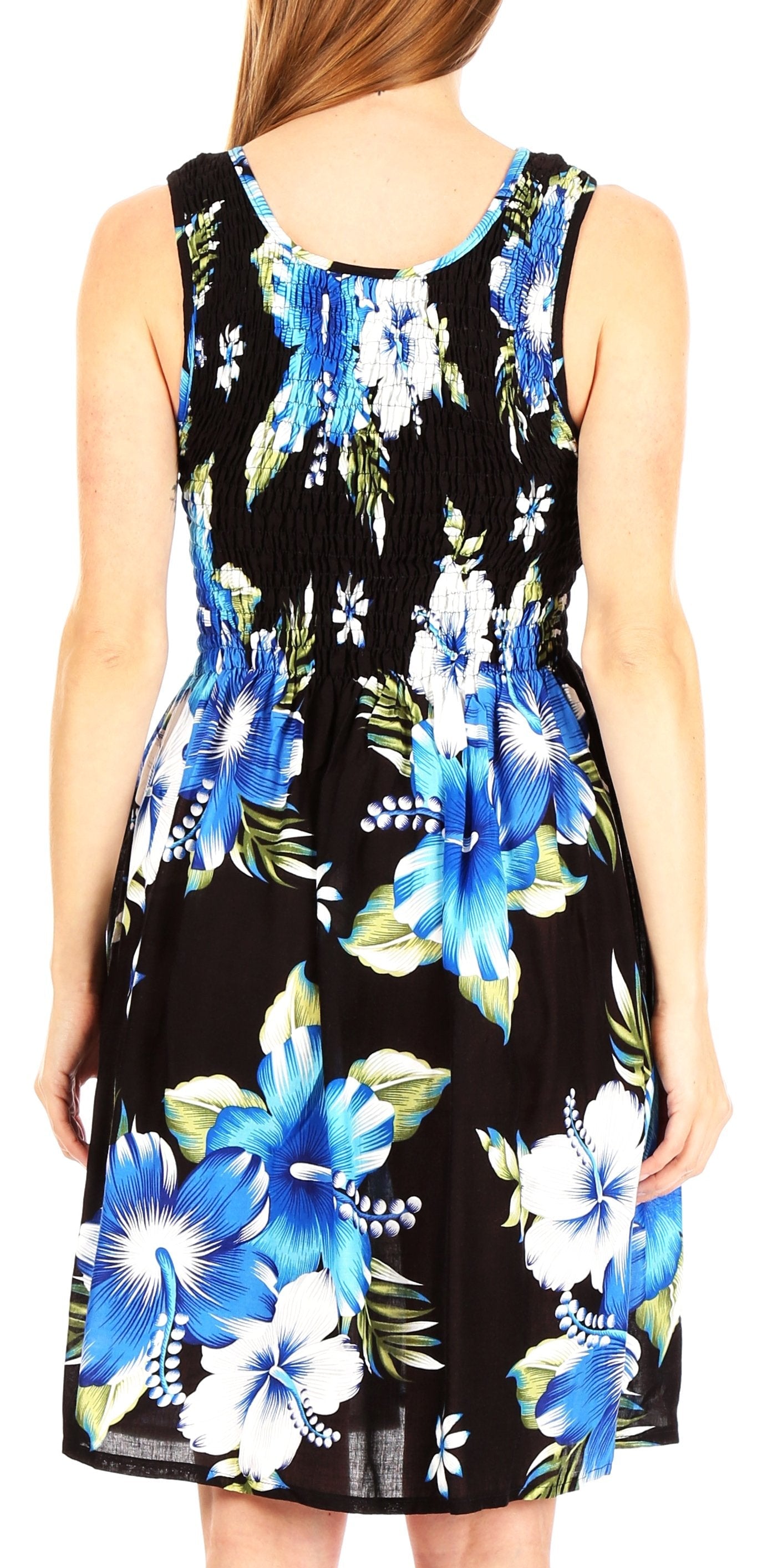 Woman wearing a sleeveless dress with blue floral pattern on a black background
