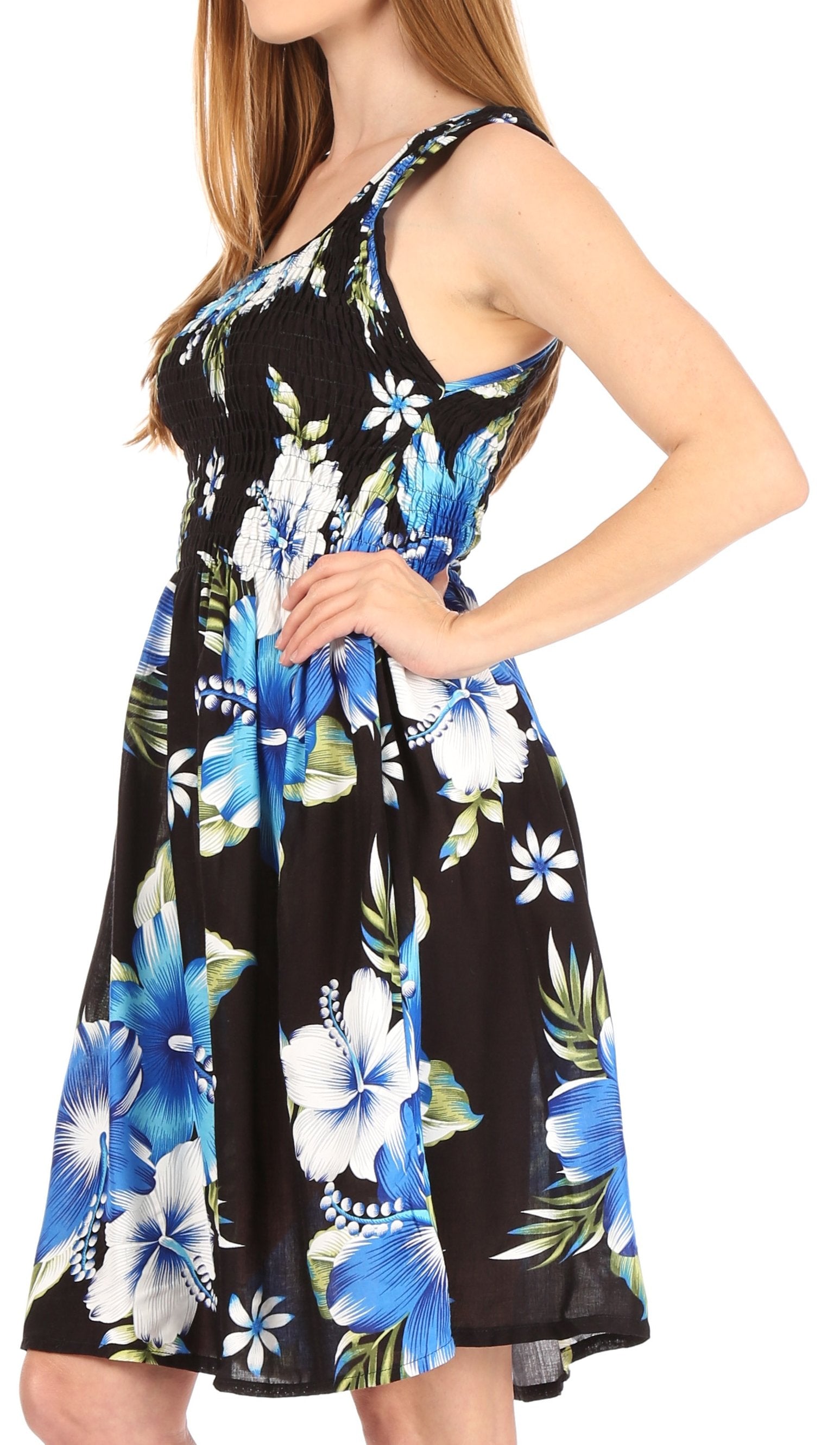 Woman wearing a floral dress with blue and white flowers on a black background