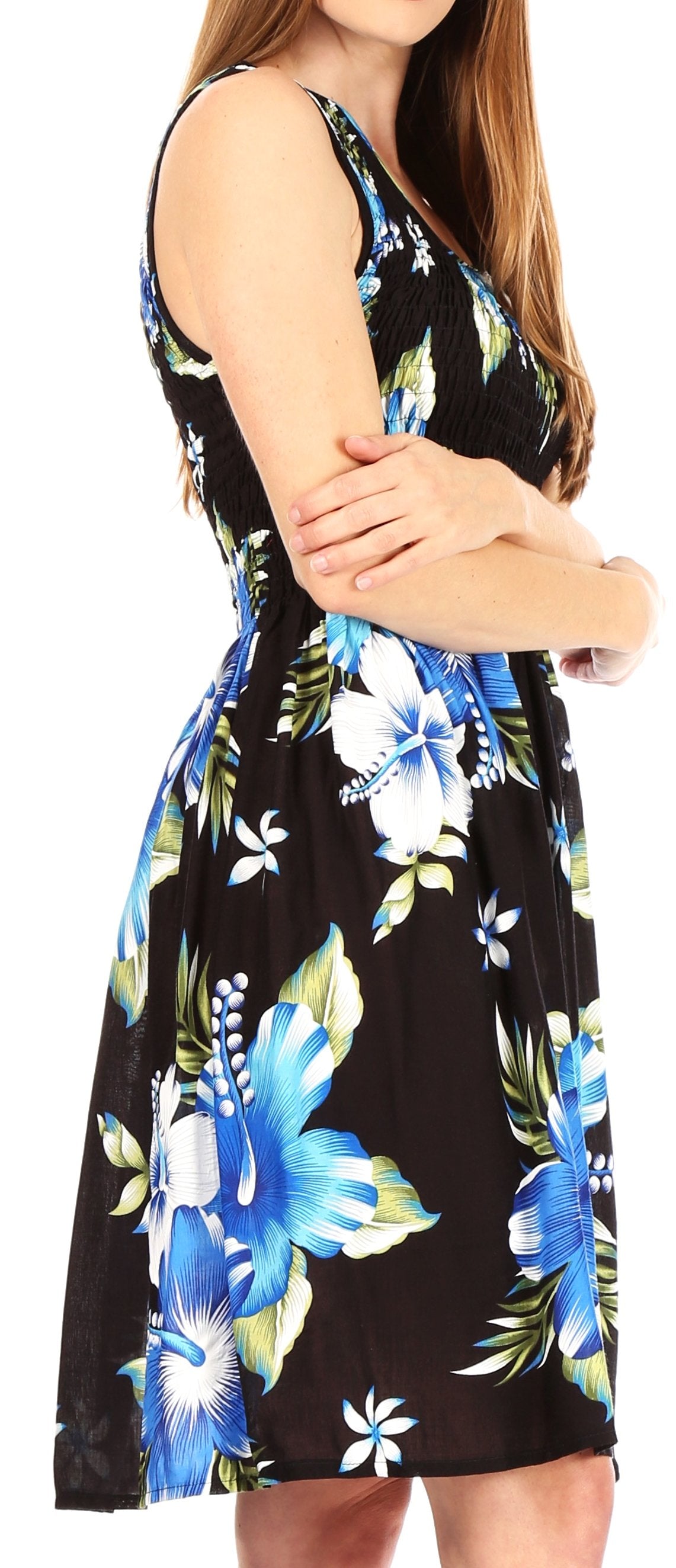 Woman wearing a black sleeveless dress with blue floral pattern