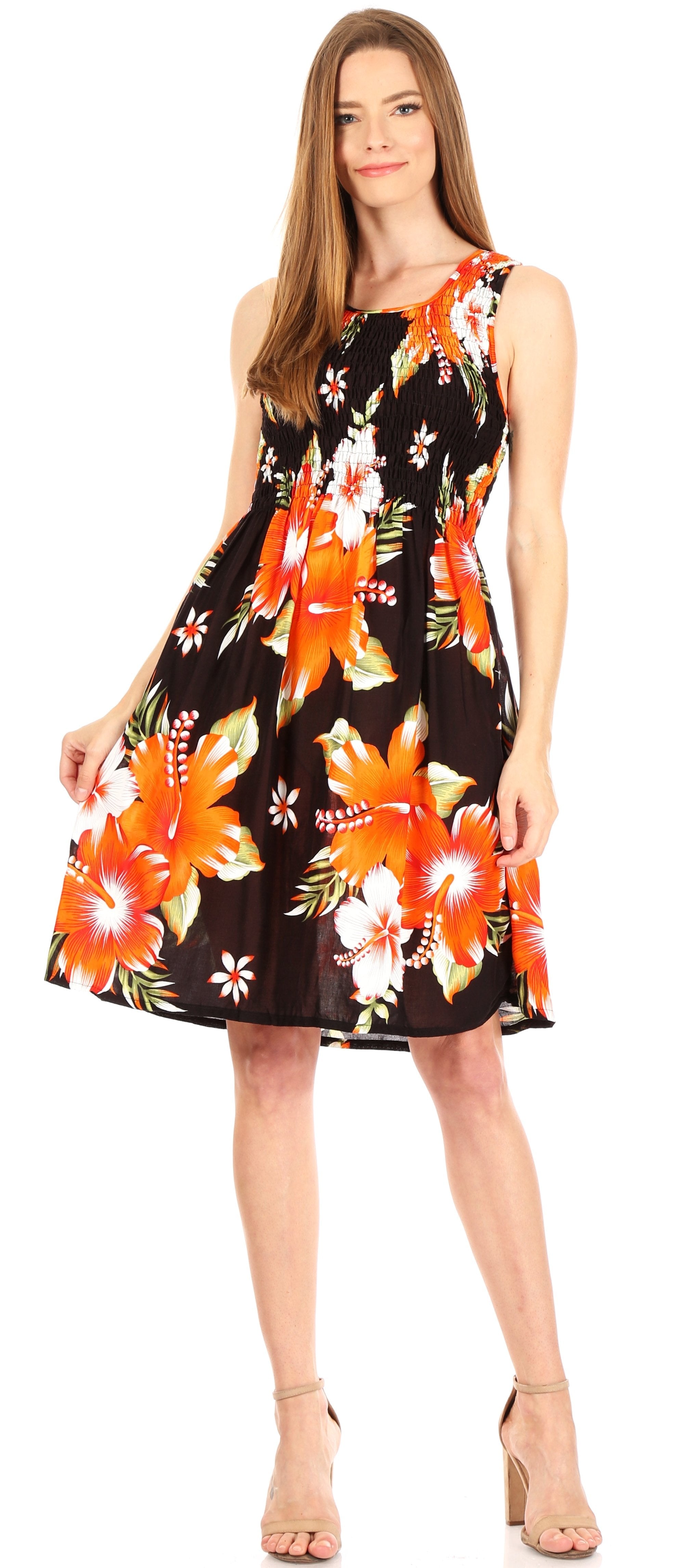 Woman wearing a sleeveless dress with orange floral pattern on a white background