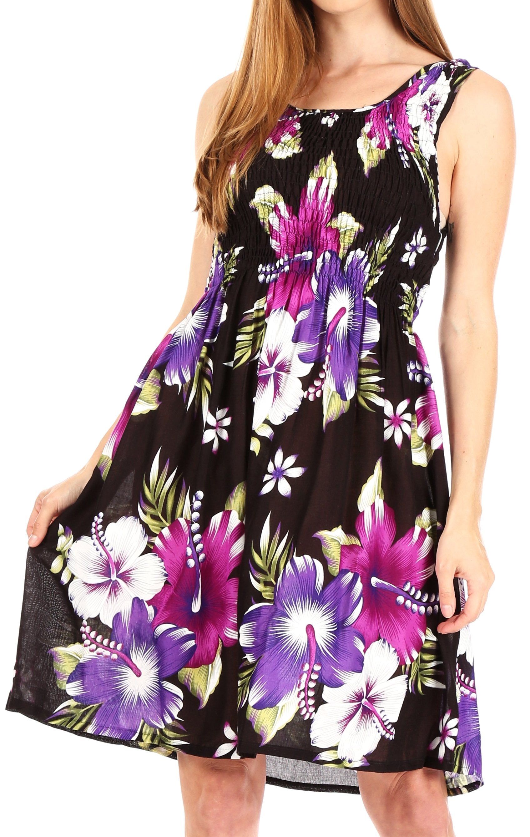 Woman wearing a black sleeveless dress with purple floral pattern on a white background