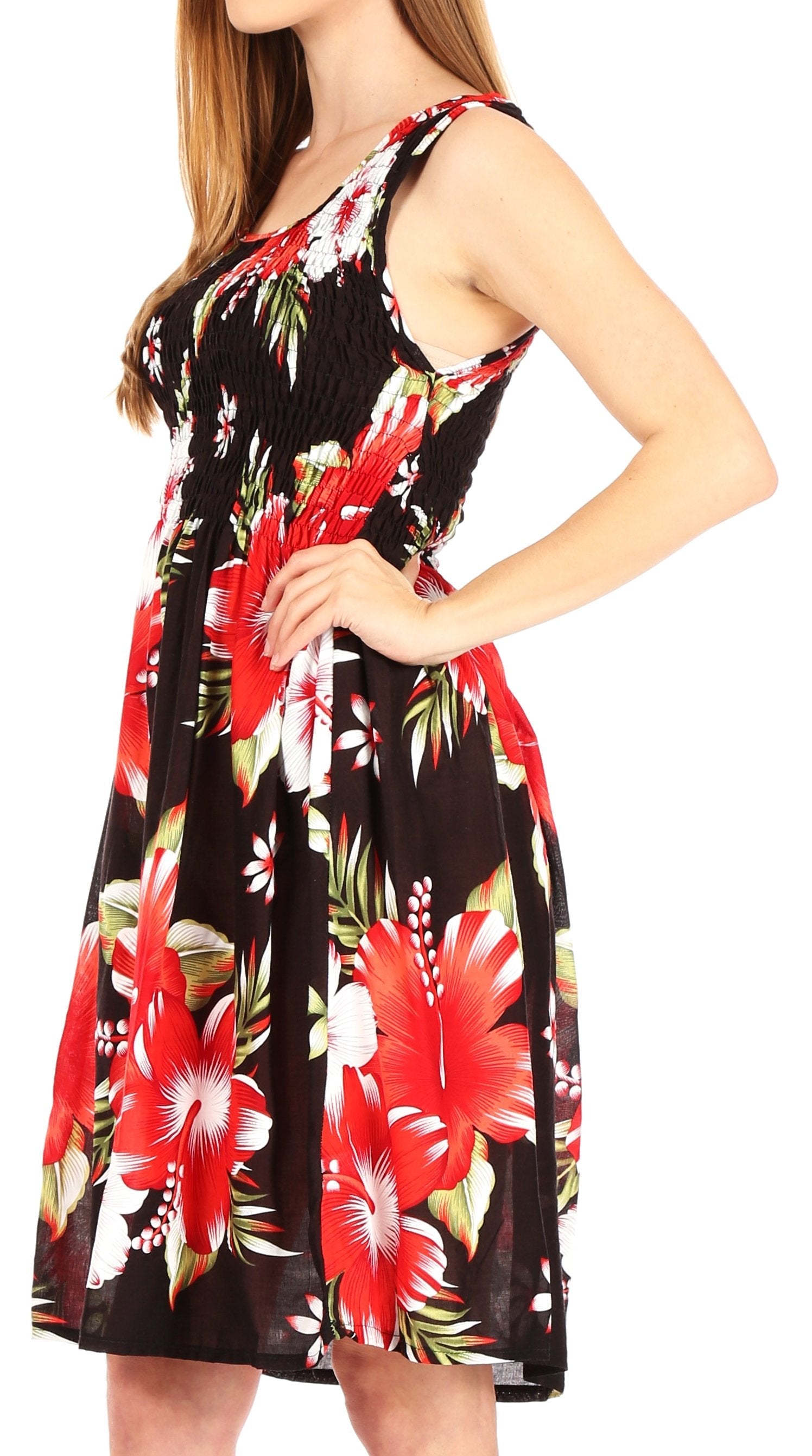 Woman wearing a sleeveless dress with a floral pattern on a white background