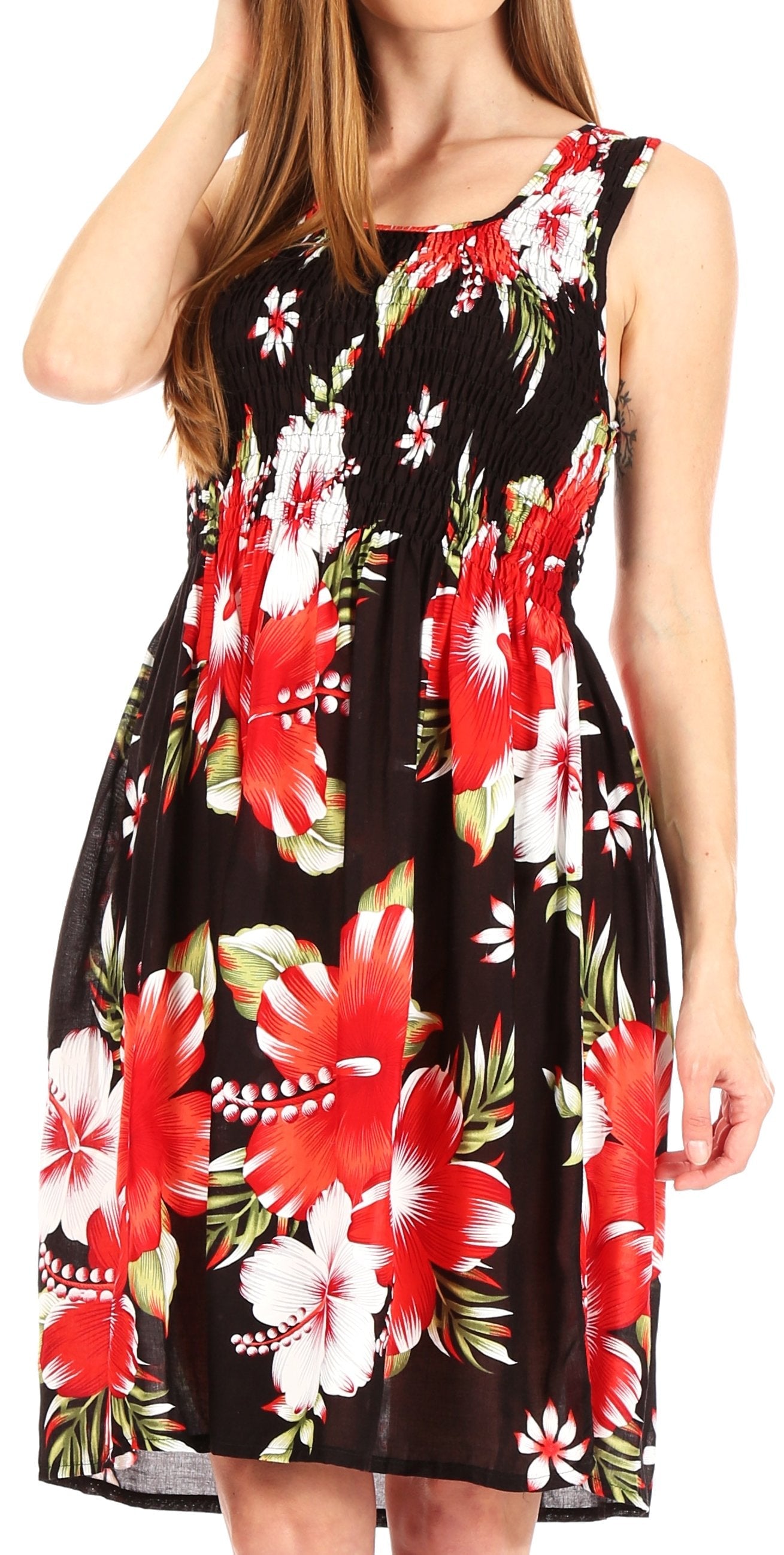 Woman wearing a sleeveless dress with red floral pattern on a black background