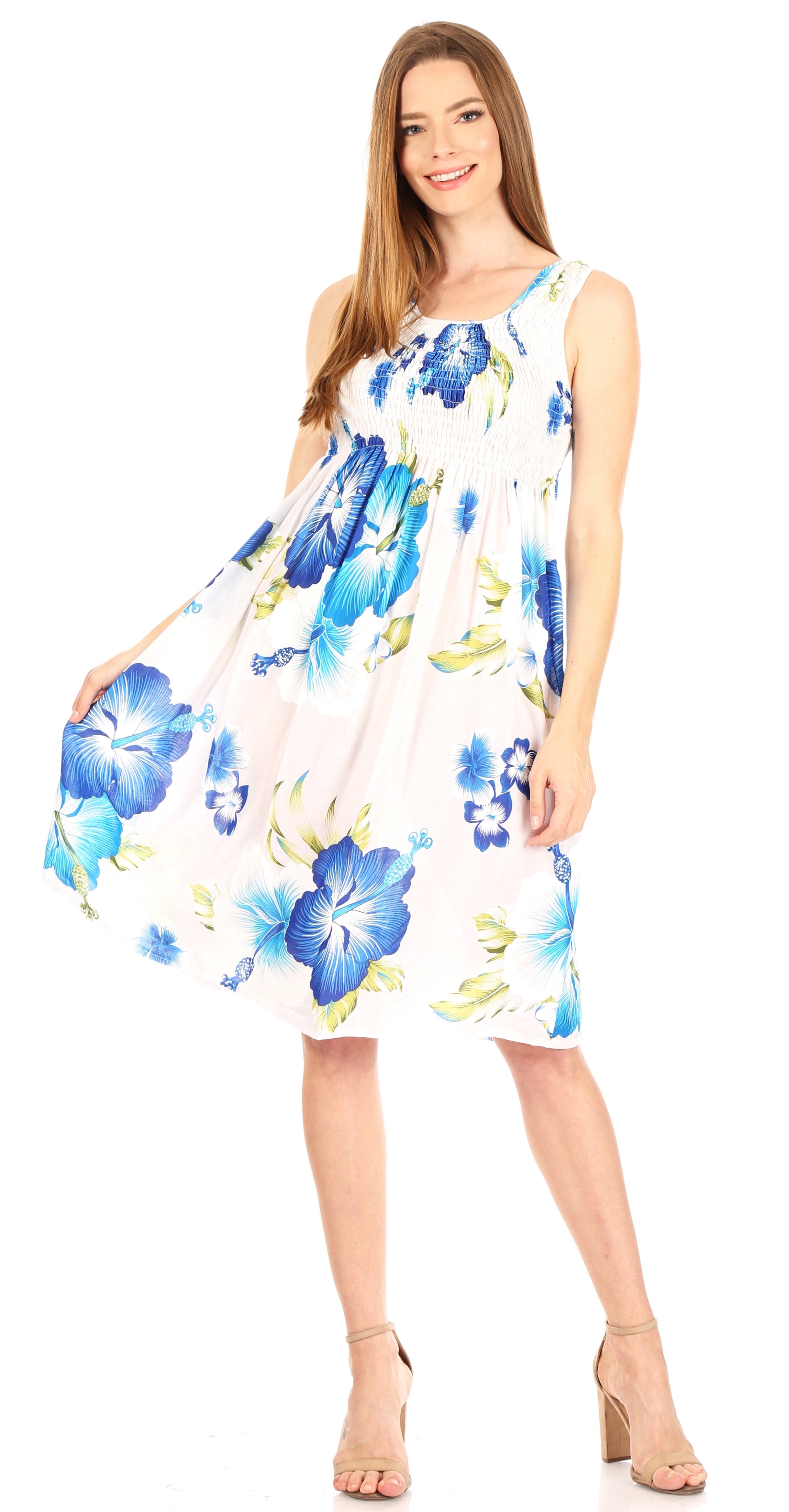 Woman wearing a floral dress with blue flowers on a white background