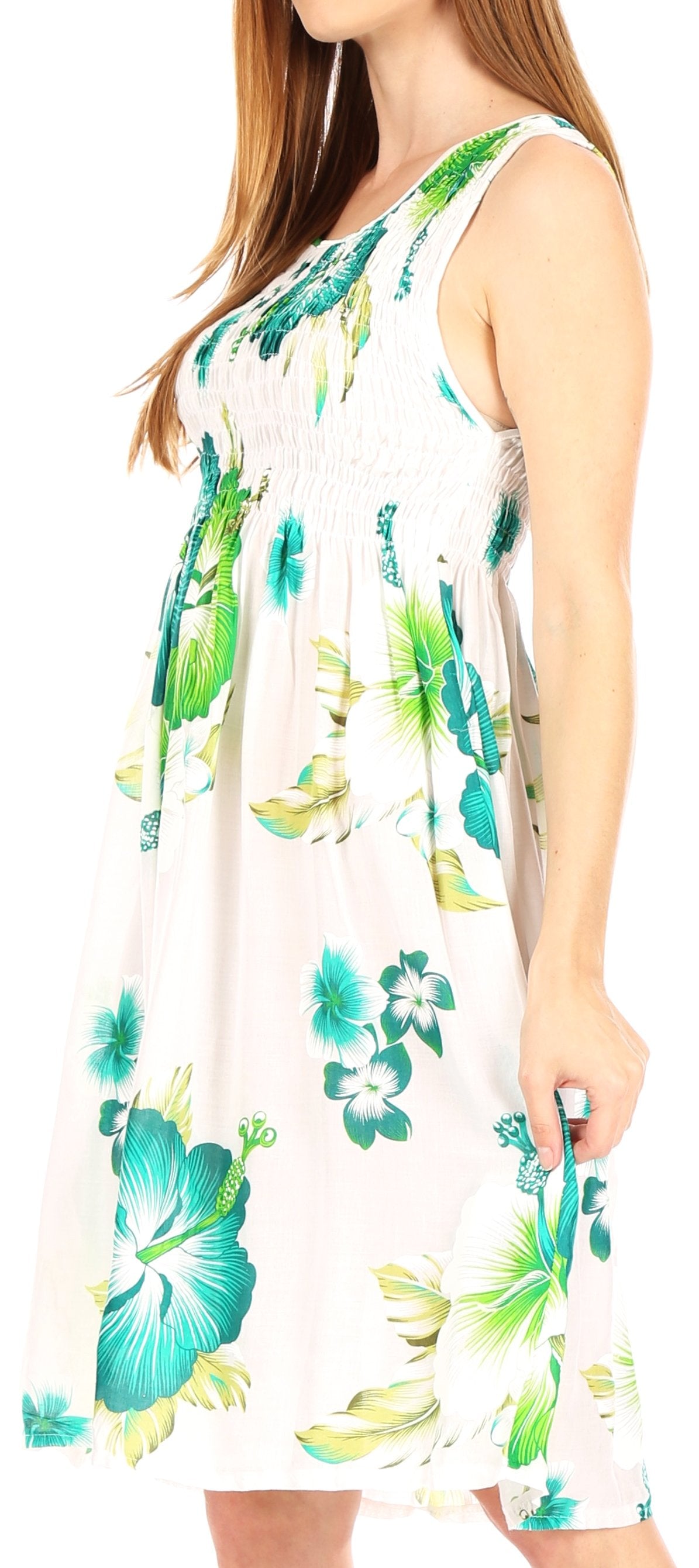 Woman wearing a sleeveless dress with floral pattern on a white background