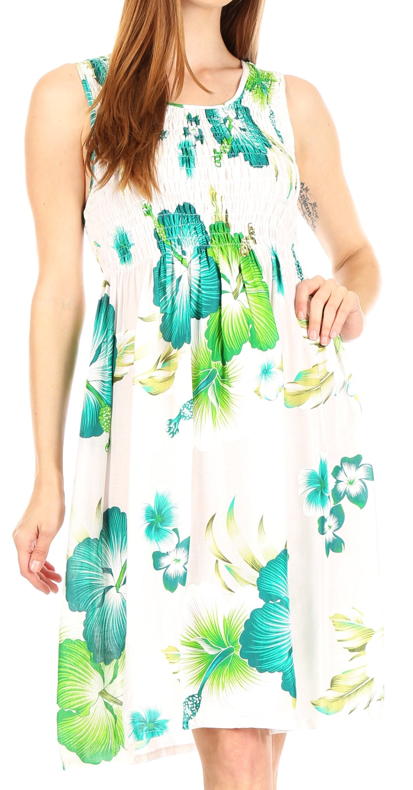 Woman wearing a sleeveless dress with a floral pattern on a white background