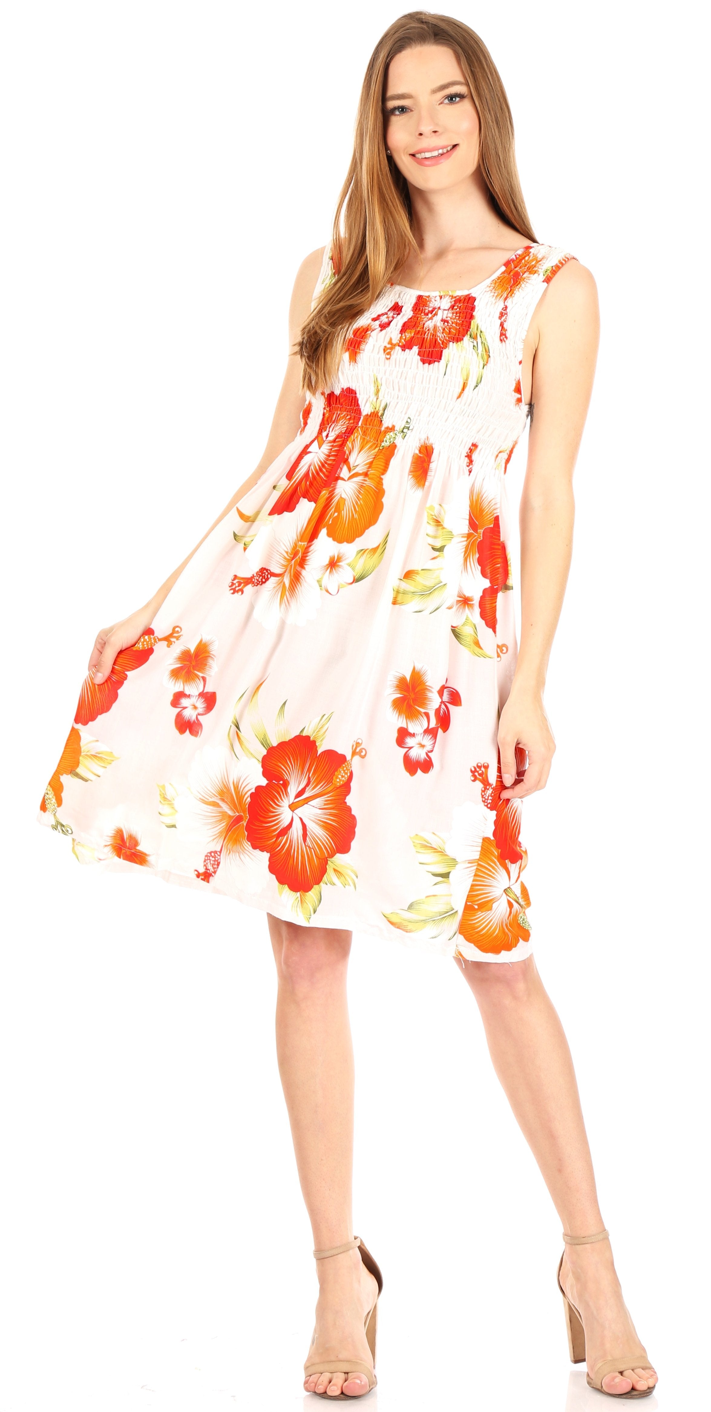 Woman wearing a floral dress with orange and red flowers on a white background
