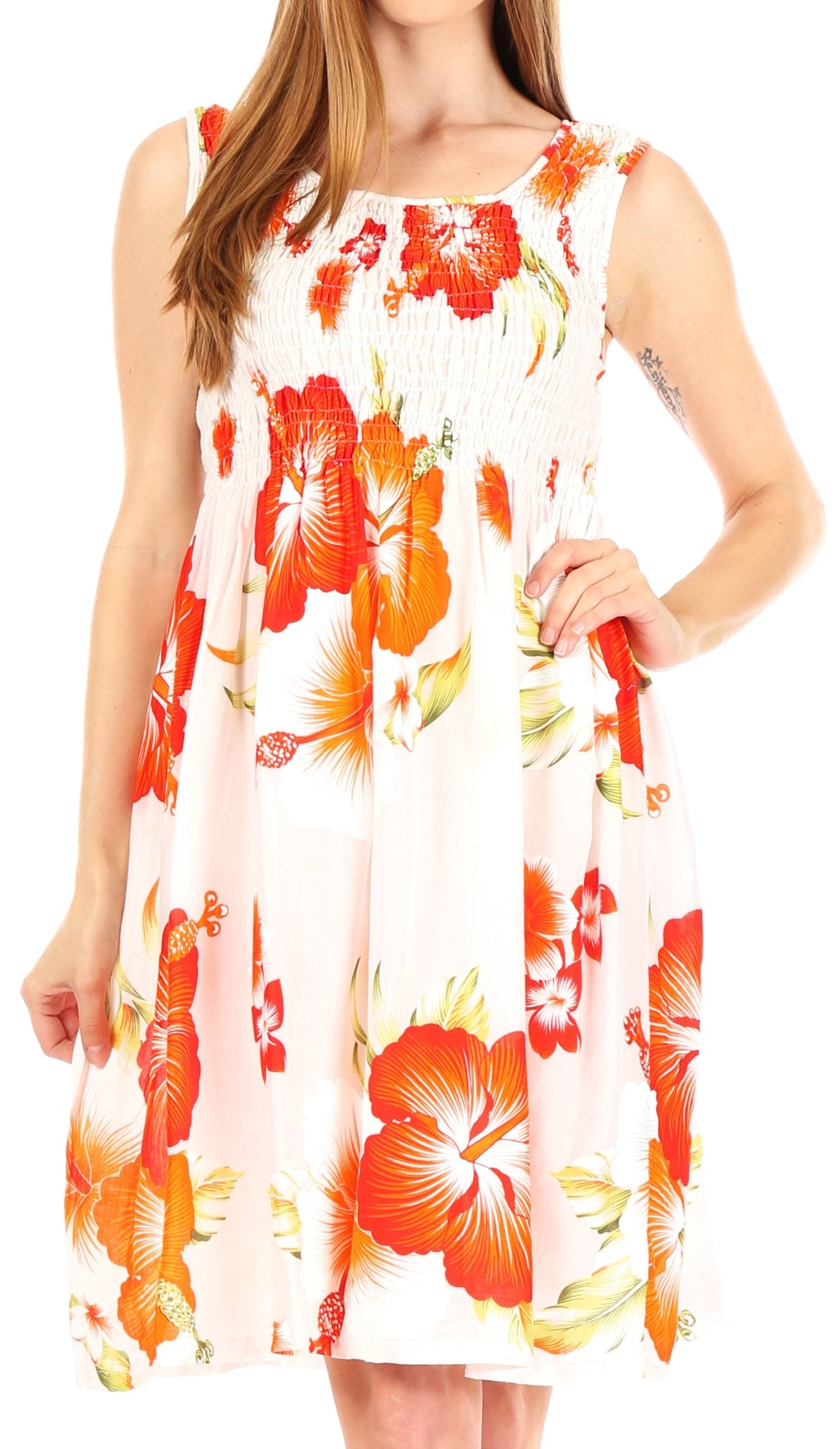 Woman wearing a sleeveless dress with orange floral pattern on a white background