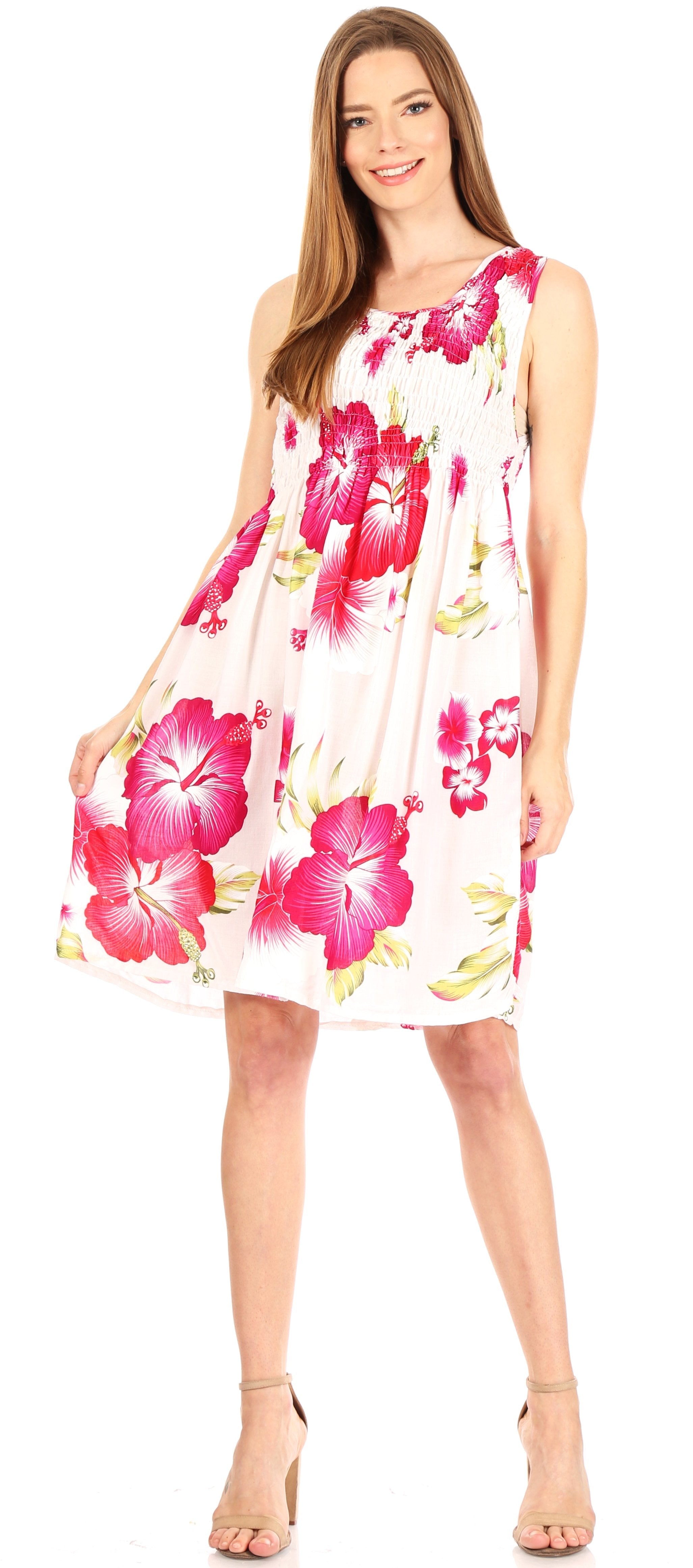 Woman wearing a floral dress with pink flowers on a white background