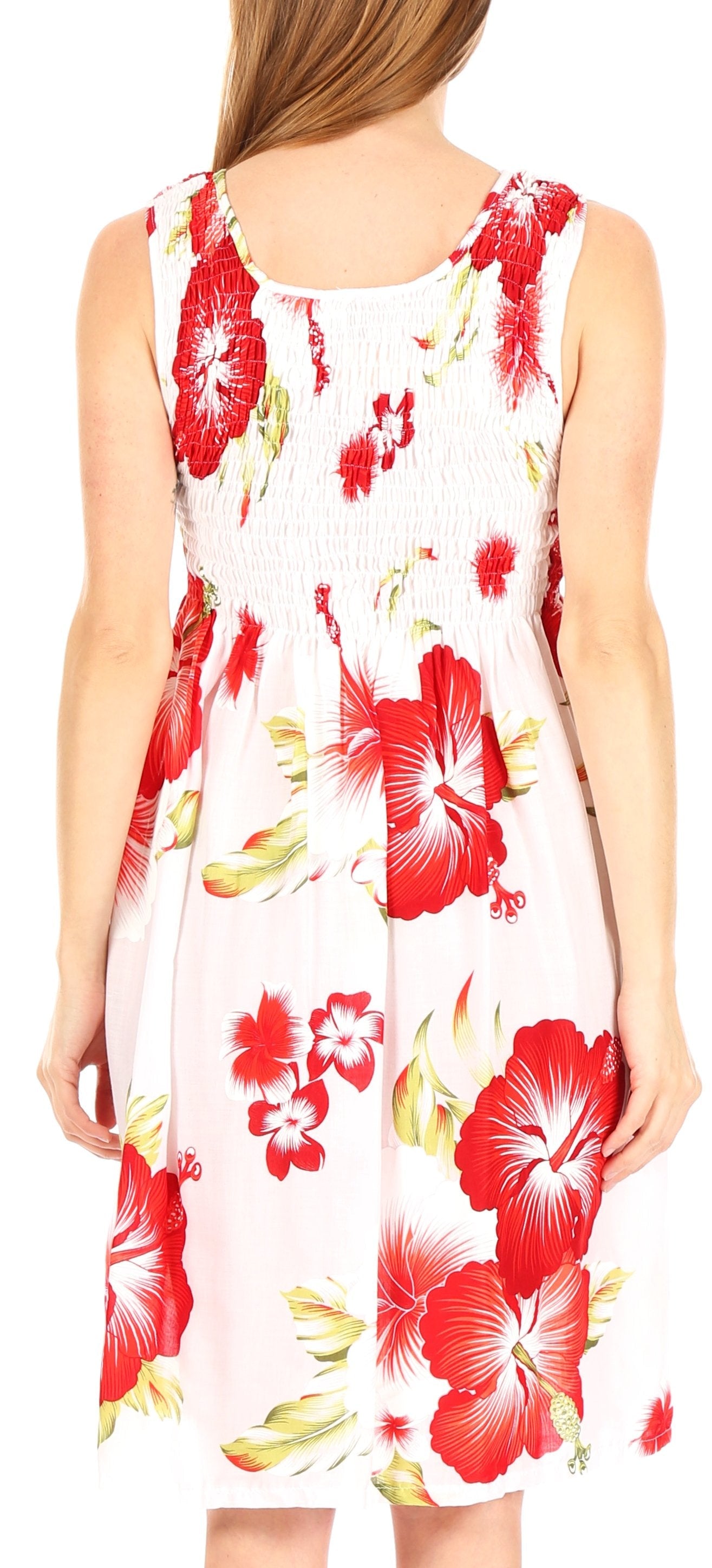 Woman wearing a sleeveless dress with red floral pattern on a white background