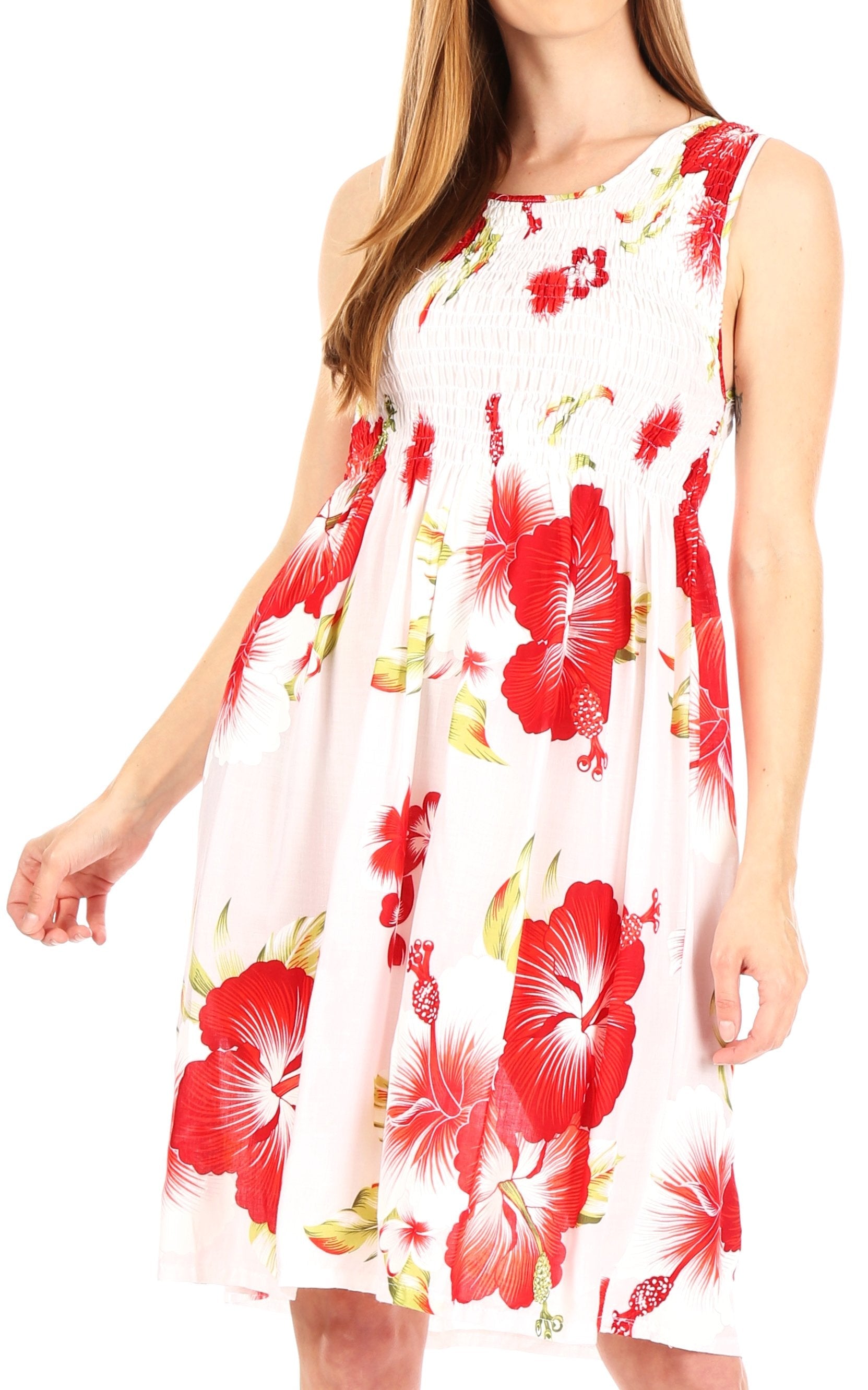 Woman wearing a sleeveless dress with red floral pattern on a white background