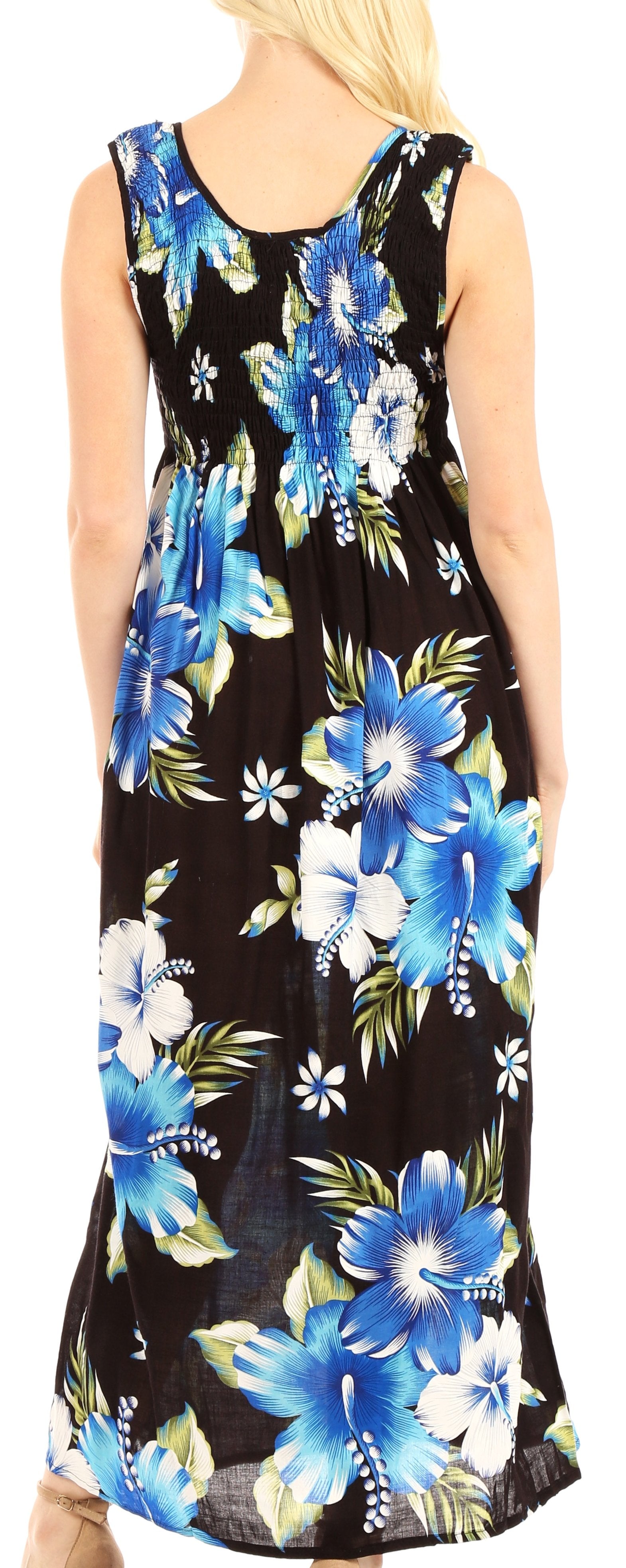 Woman wearing a sleeveless dress with blue floral pattern on black background