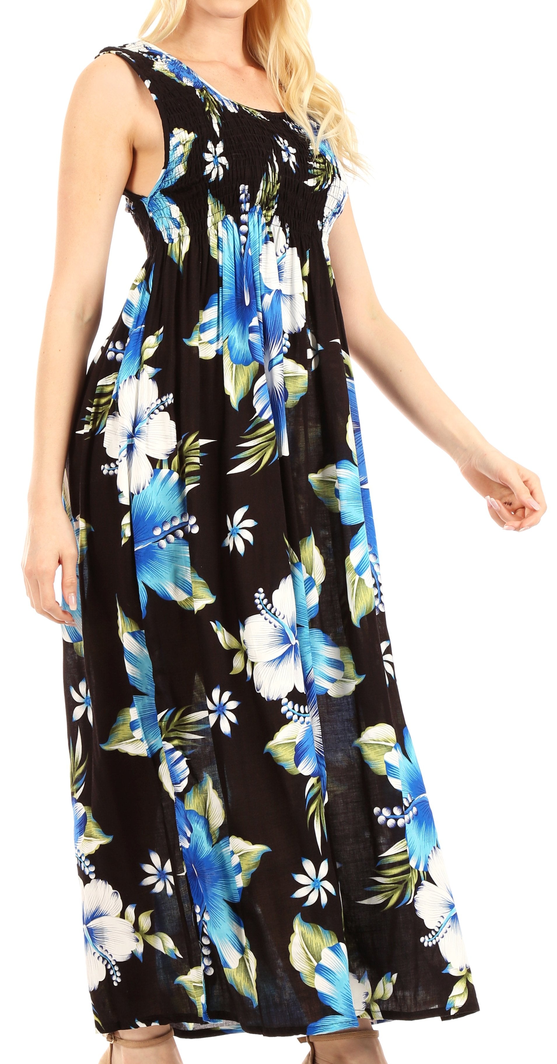 Woman wearing a black floral dress with blue and green flowers on a white background