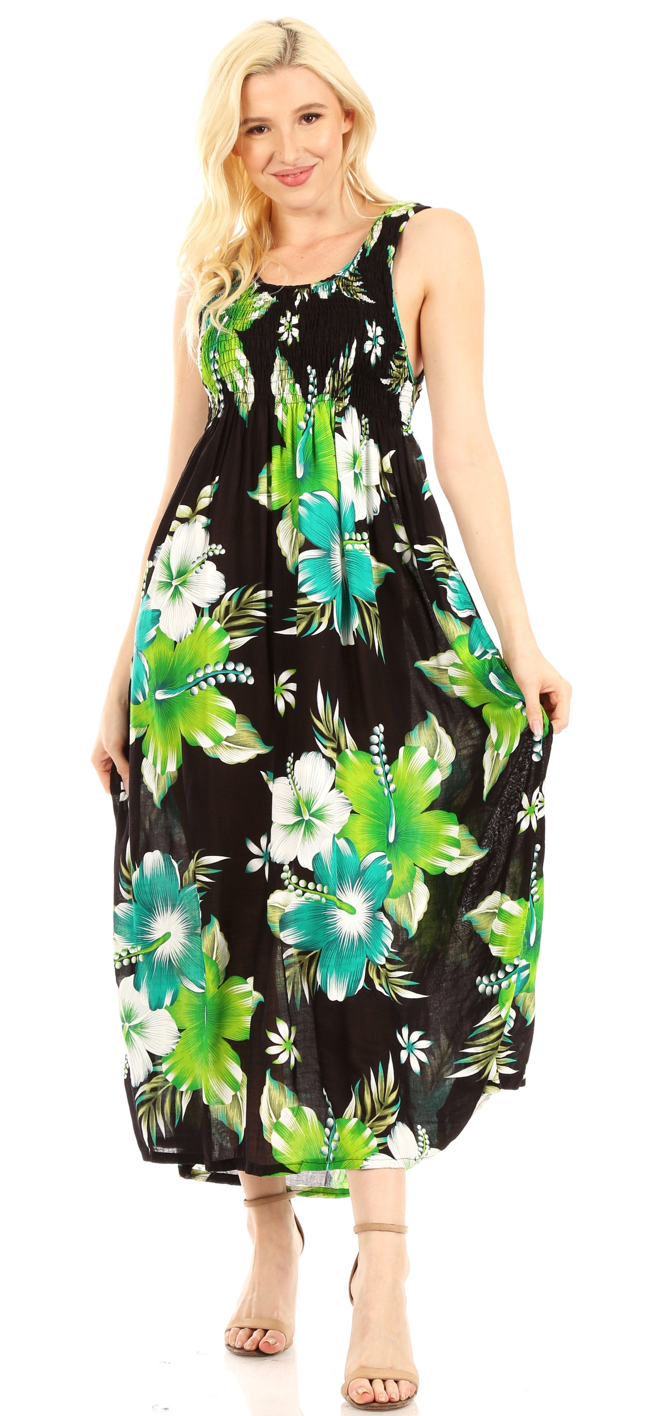 Woman wearing a black dress with green and white floral pattern