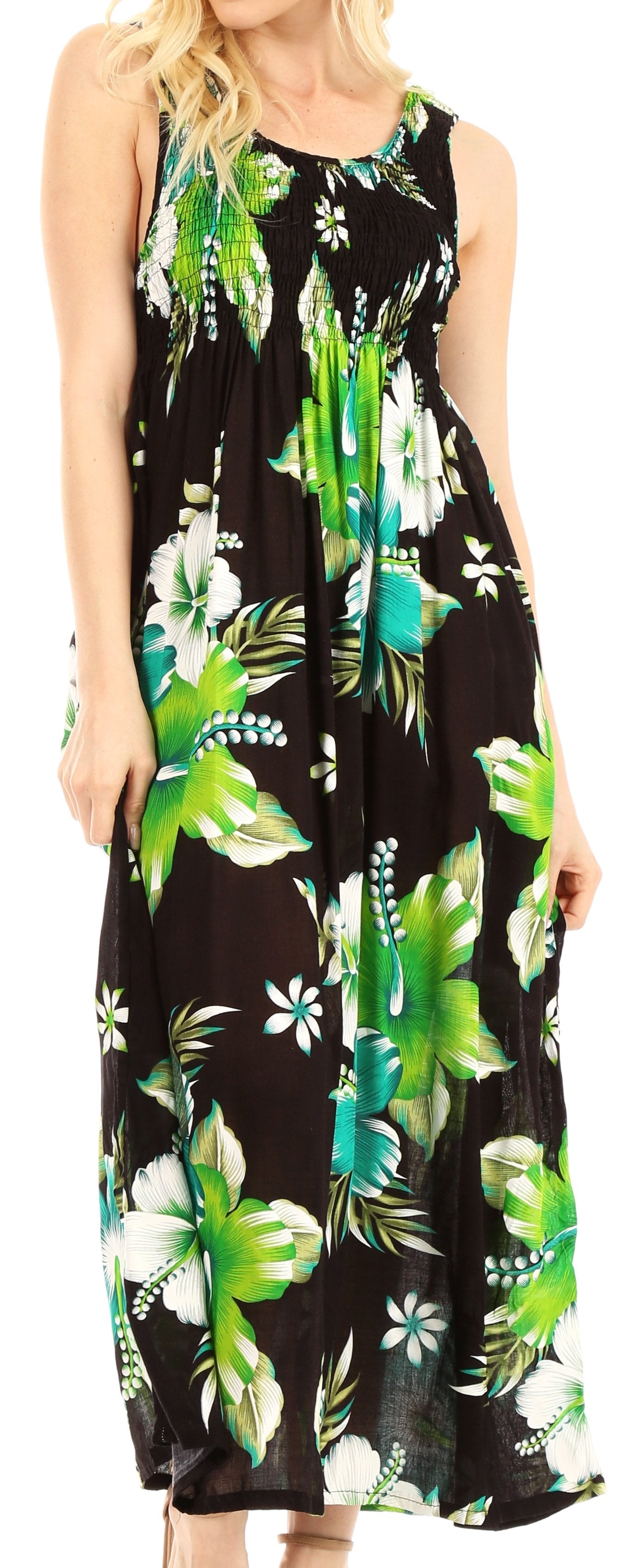 Woman wearing a black sleeveless dress with green floral pattern