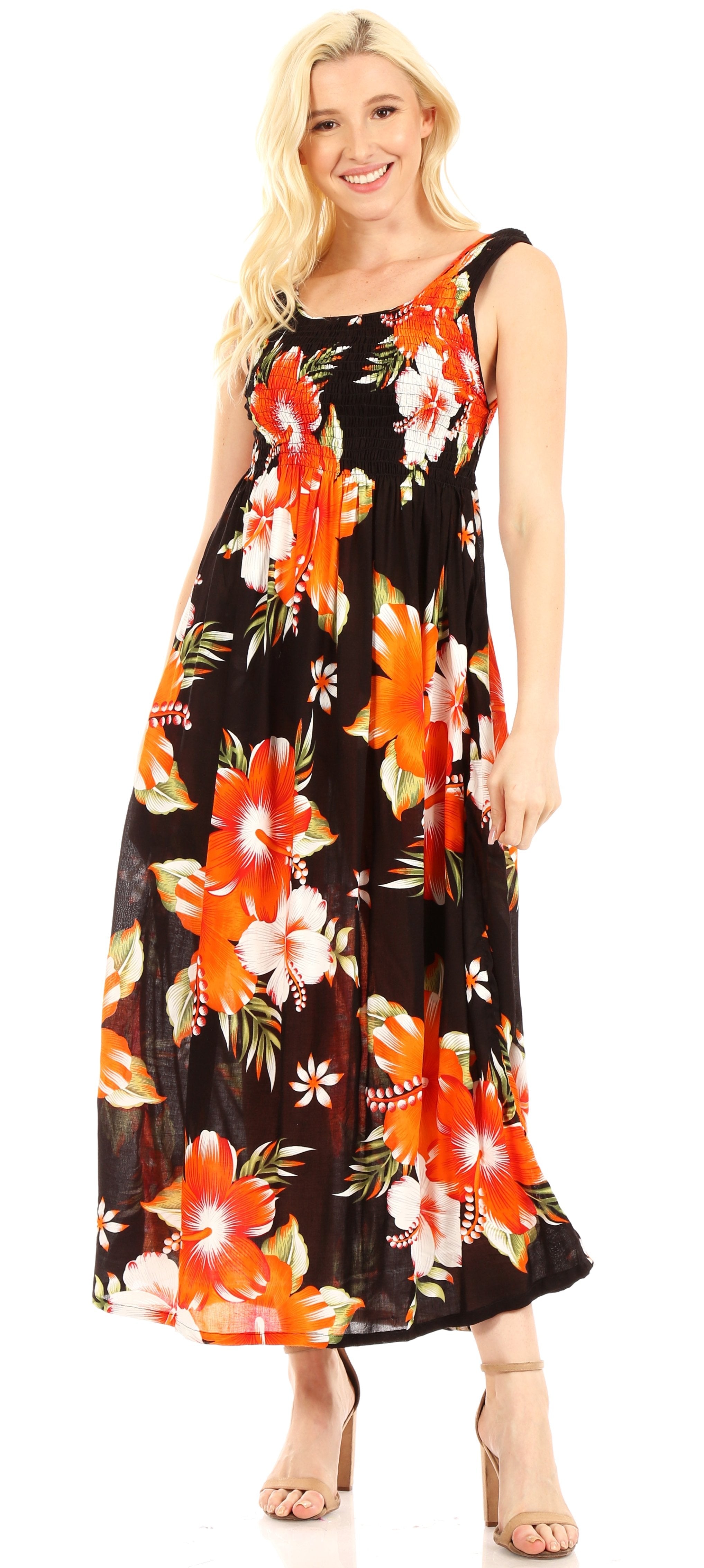 Woman wearing a floral dress with orange and red flowers on a black background