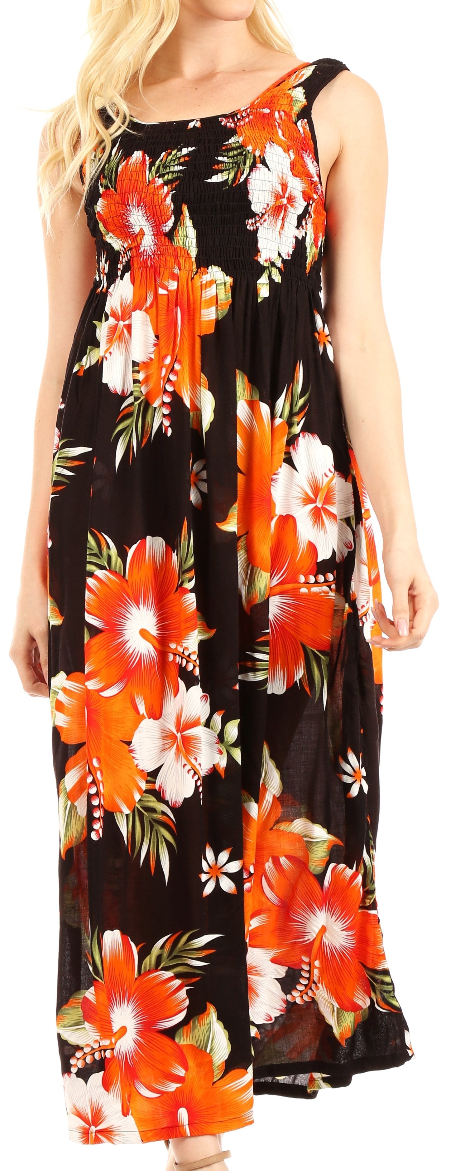 Woman wearing a sleeveless dress with orange and white floral pattern on a black background