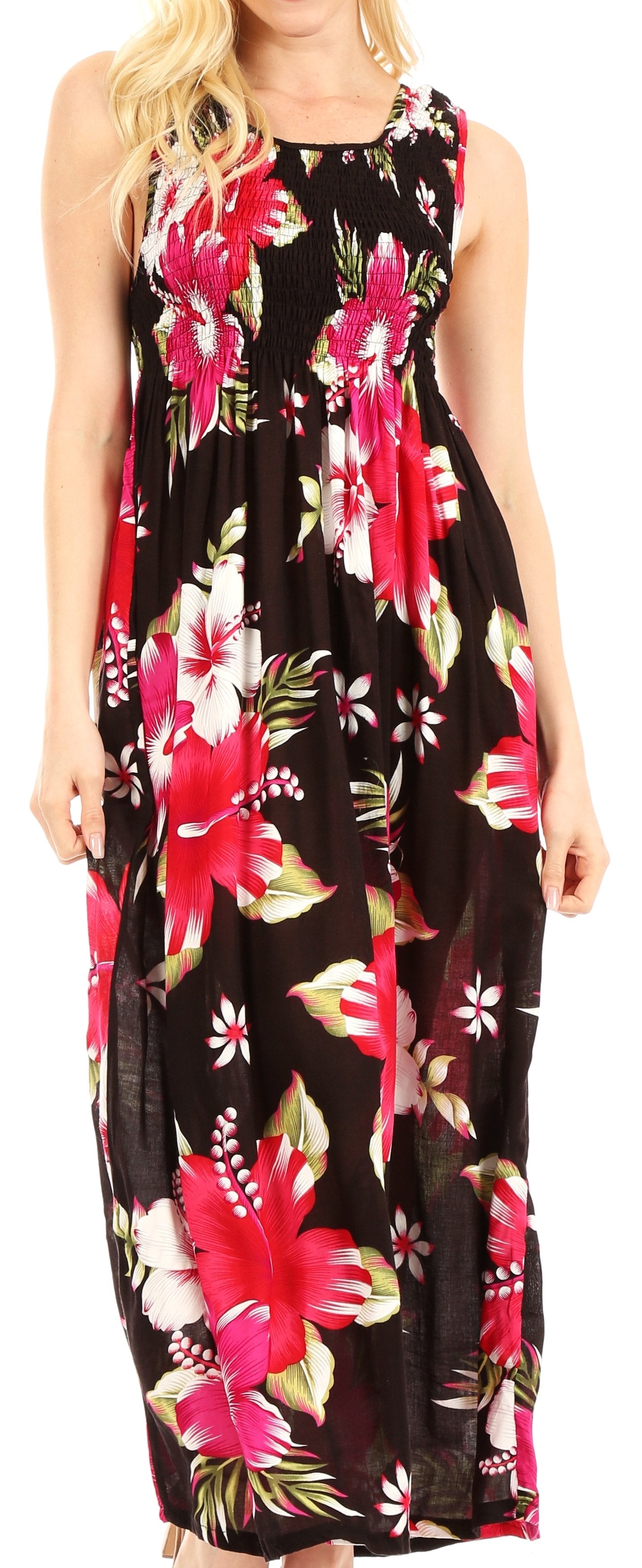 Woman wearing a sleeveless floral dress with pink and white flowers on a black background.