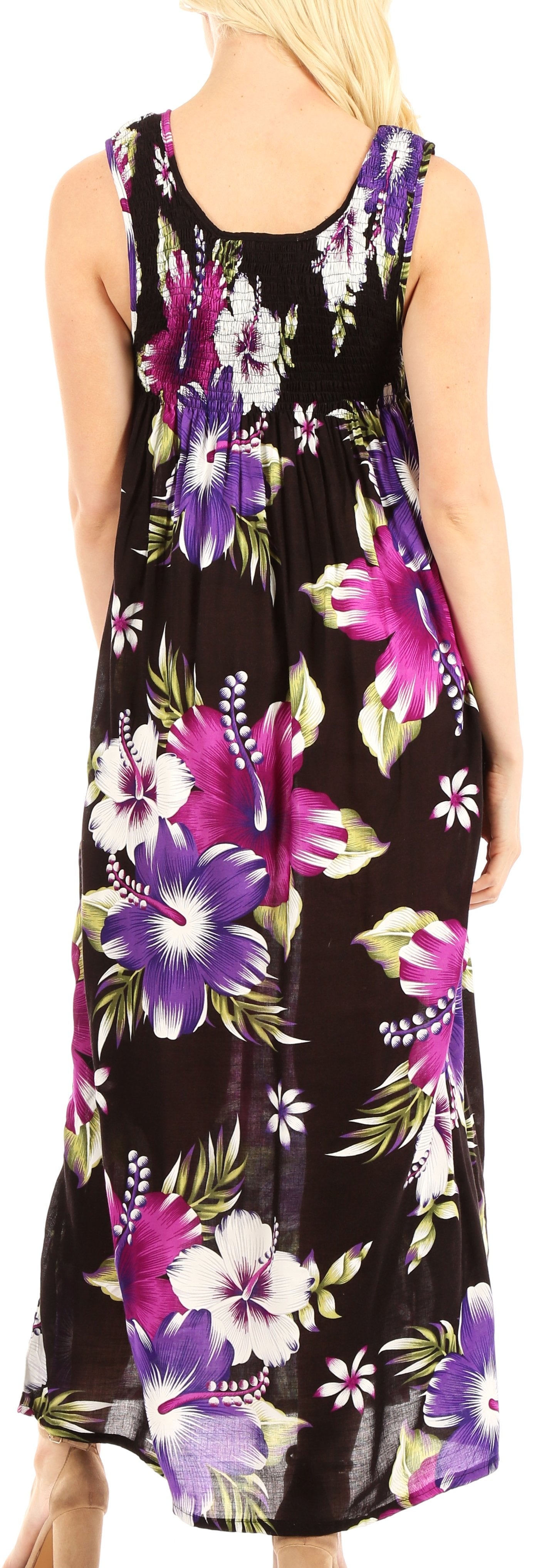 Woman wearing a sleeveless floral dress with a black background