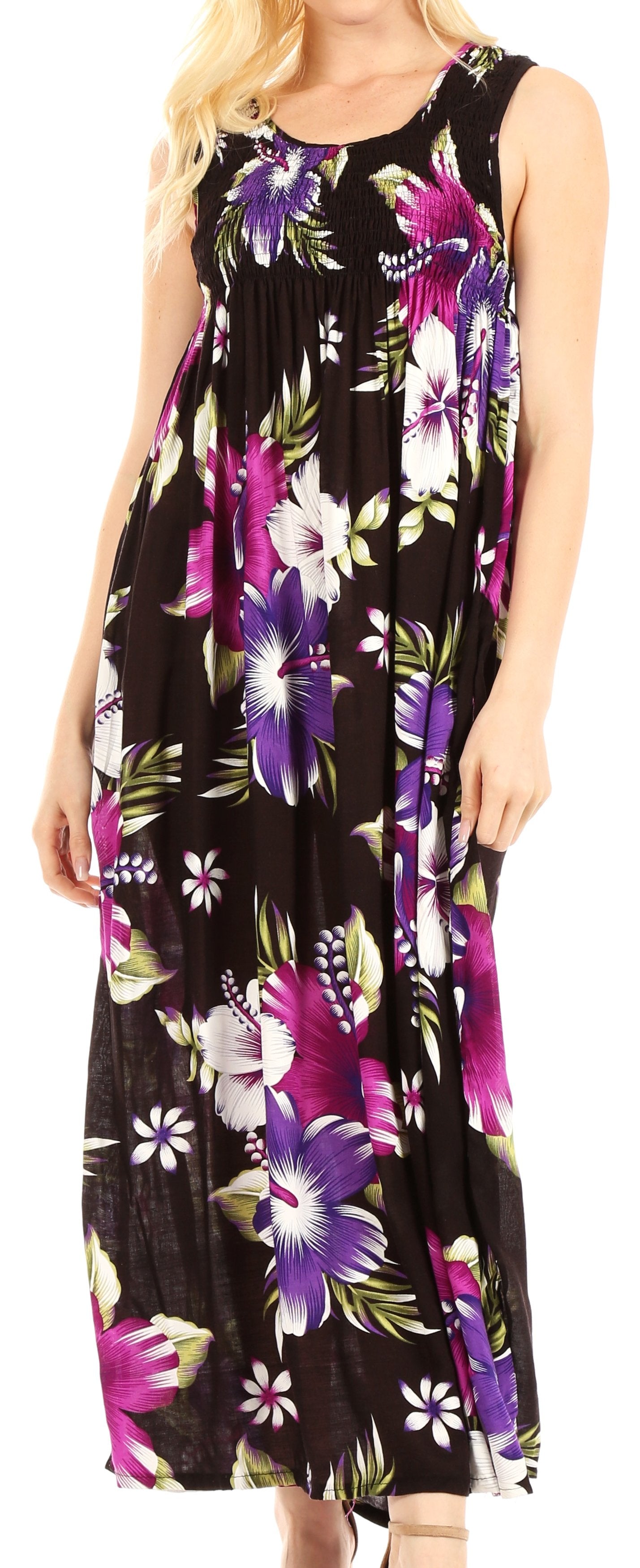 Woman wearing a sleeveless floral dress with a black background