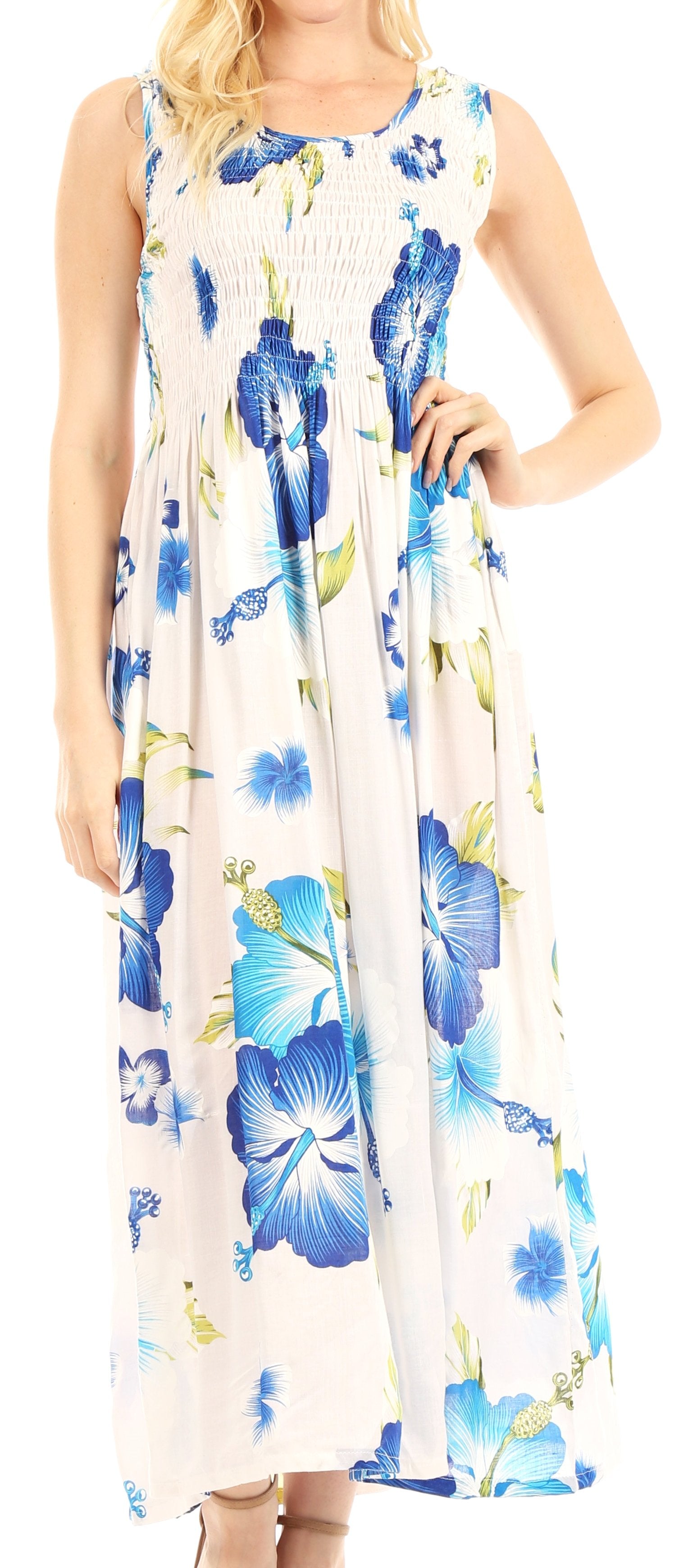 Woman wearing a sleeveless floral dress with blue flowers on a white background