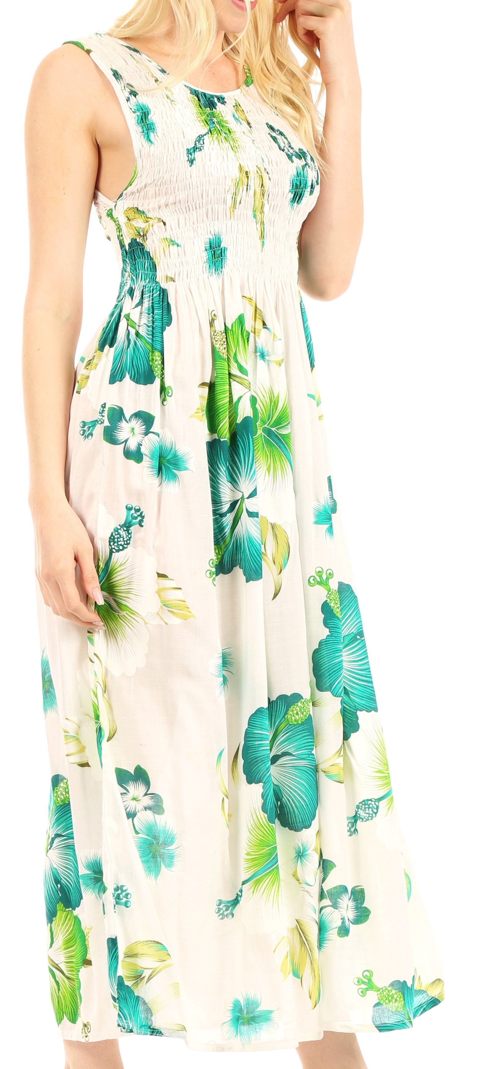 Woman wearing a floral dress with blue and green flowers on a white background