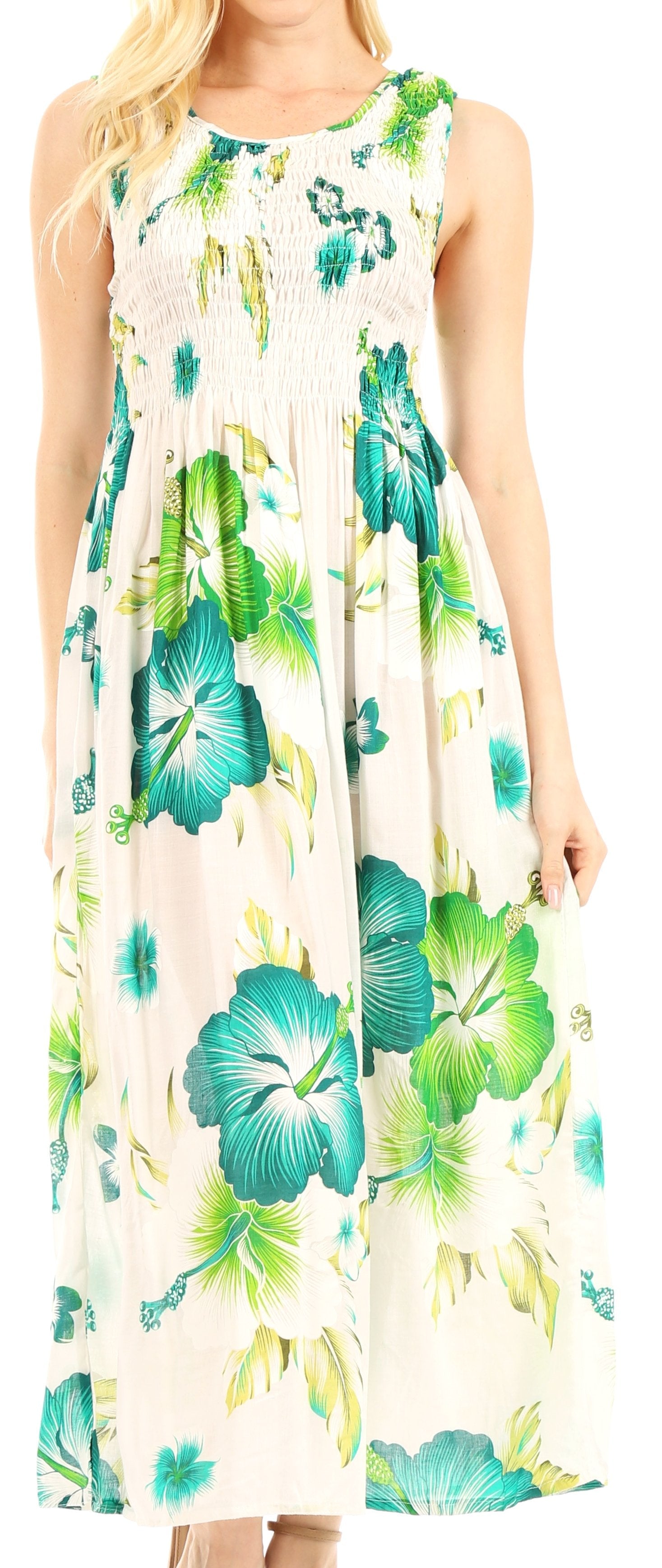 Woman wearing a floral dress with green and blue flowers on a white background
