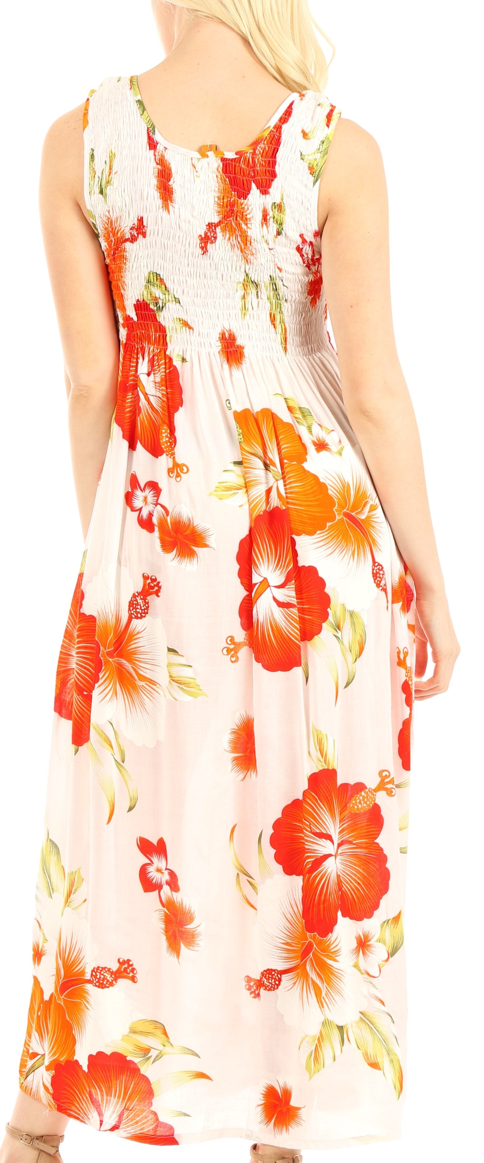 Woman wearing a sleeveless floral dress with orange and red flowers on a white background