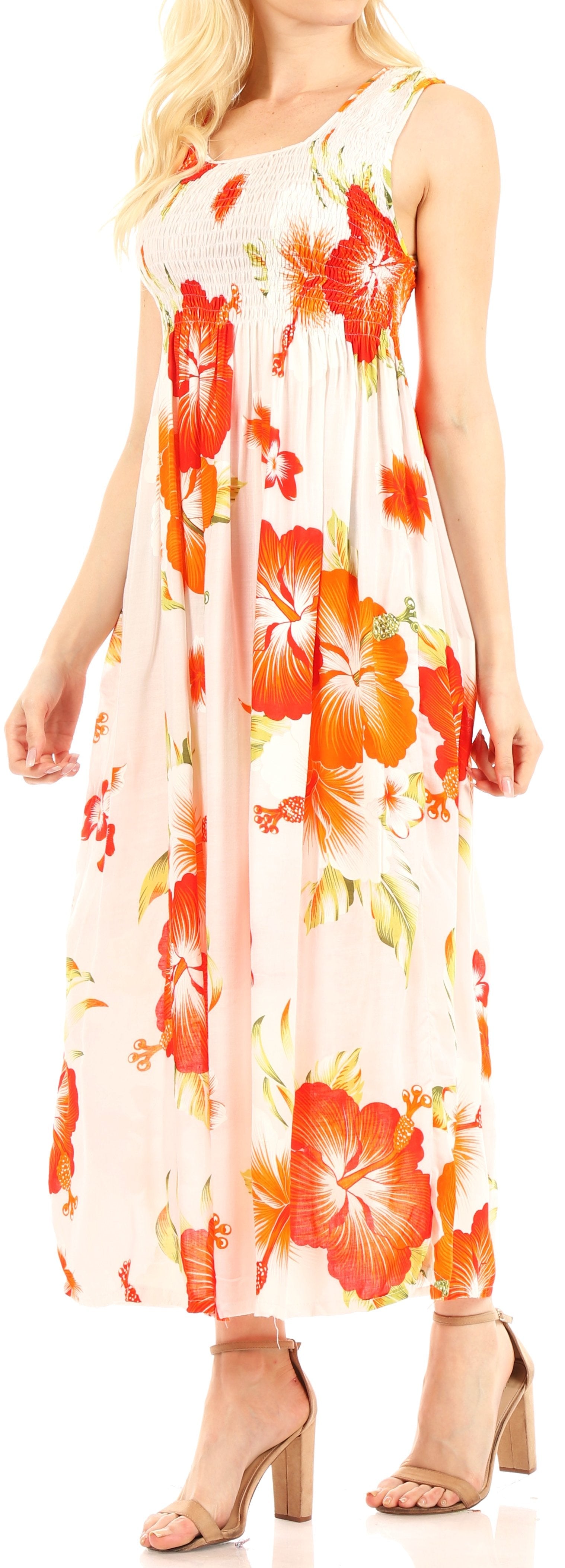 Woman wearing a sleeveless floral dress with orange flowers on a white background