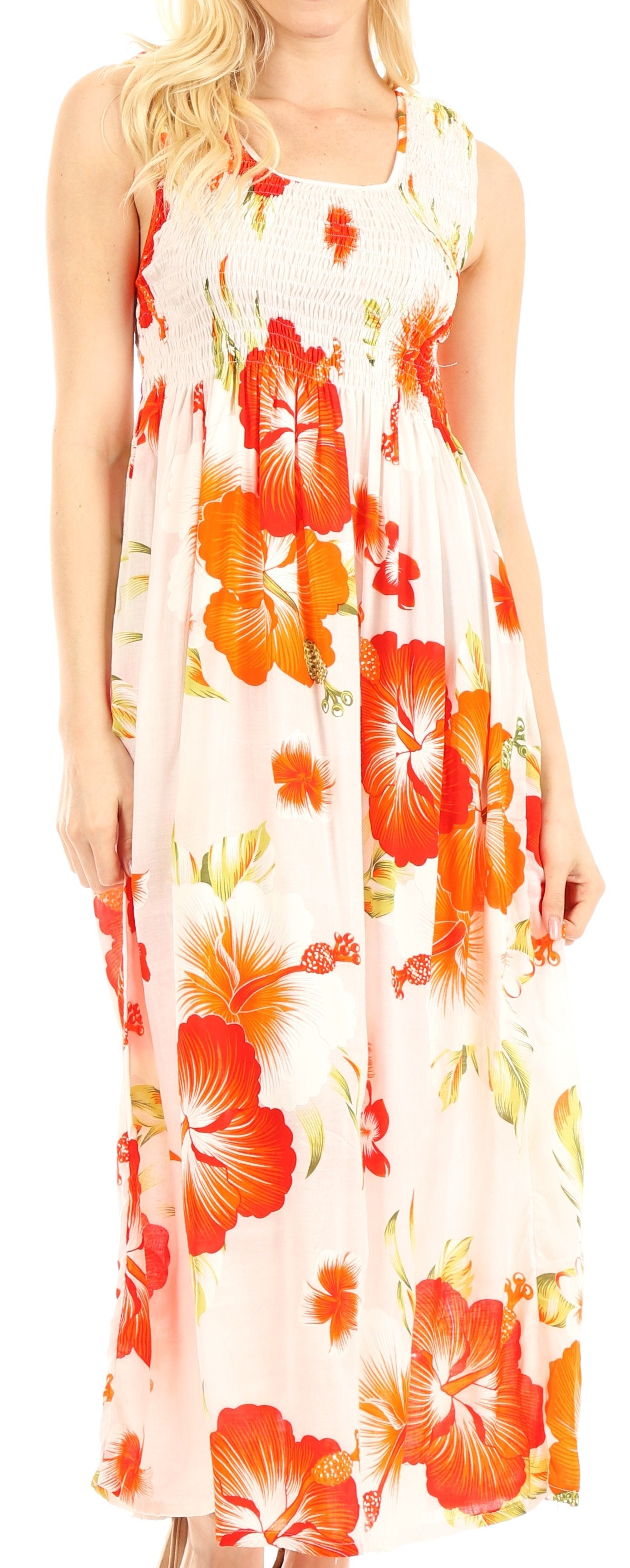 Woman wearing a sleeveless floral dress with orange and yellow flowers on a white background