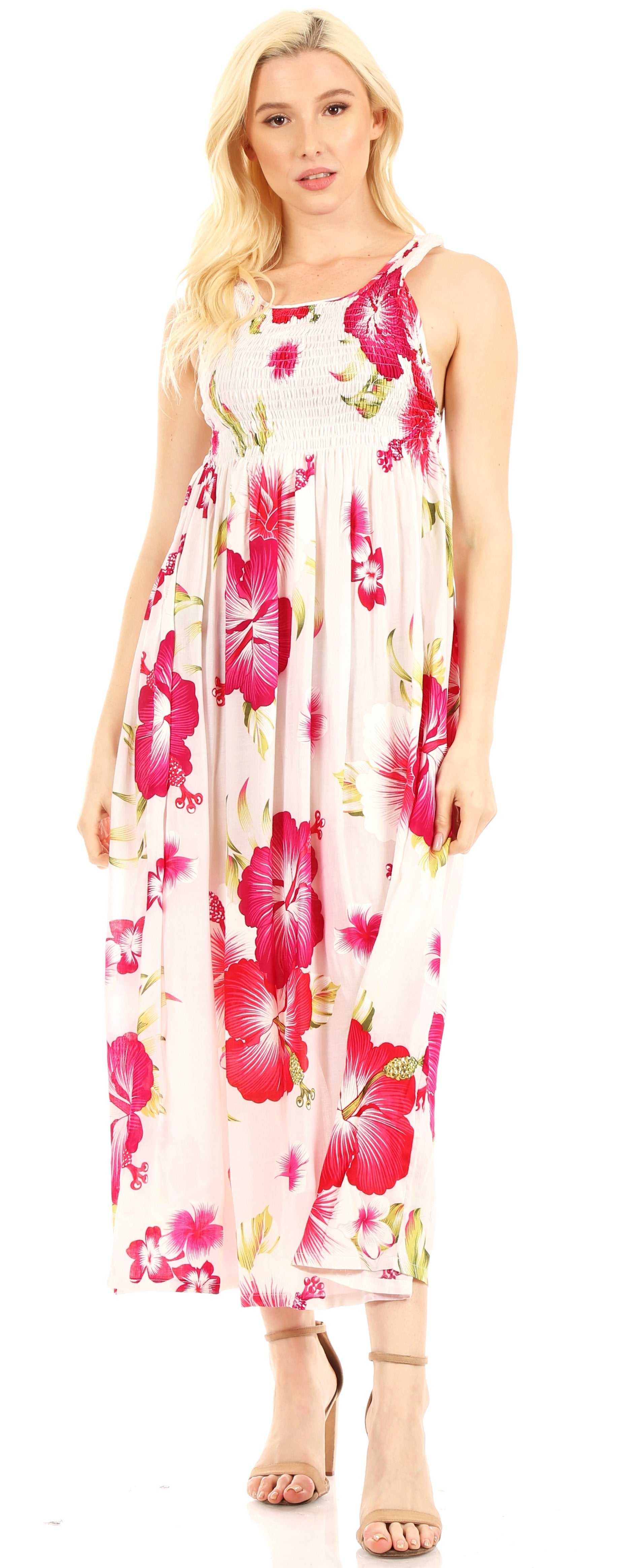 Woman wearing a floral dress with pink and red flowers on a white background