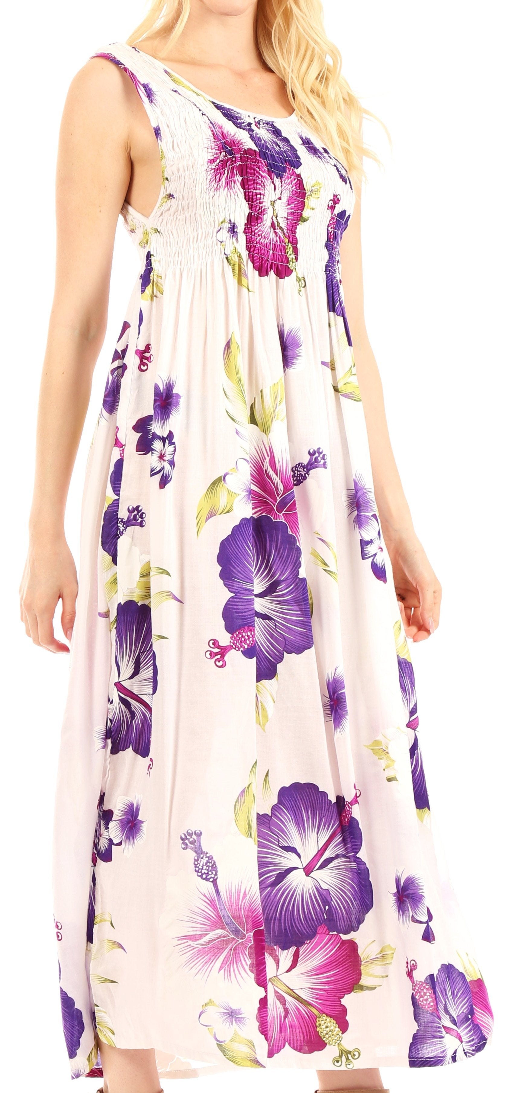 Woman wearing a floral dress with purple and pink flowers on a white background