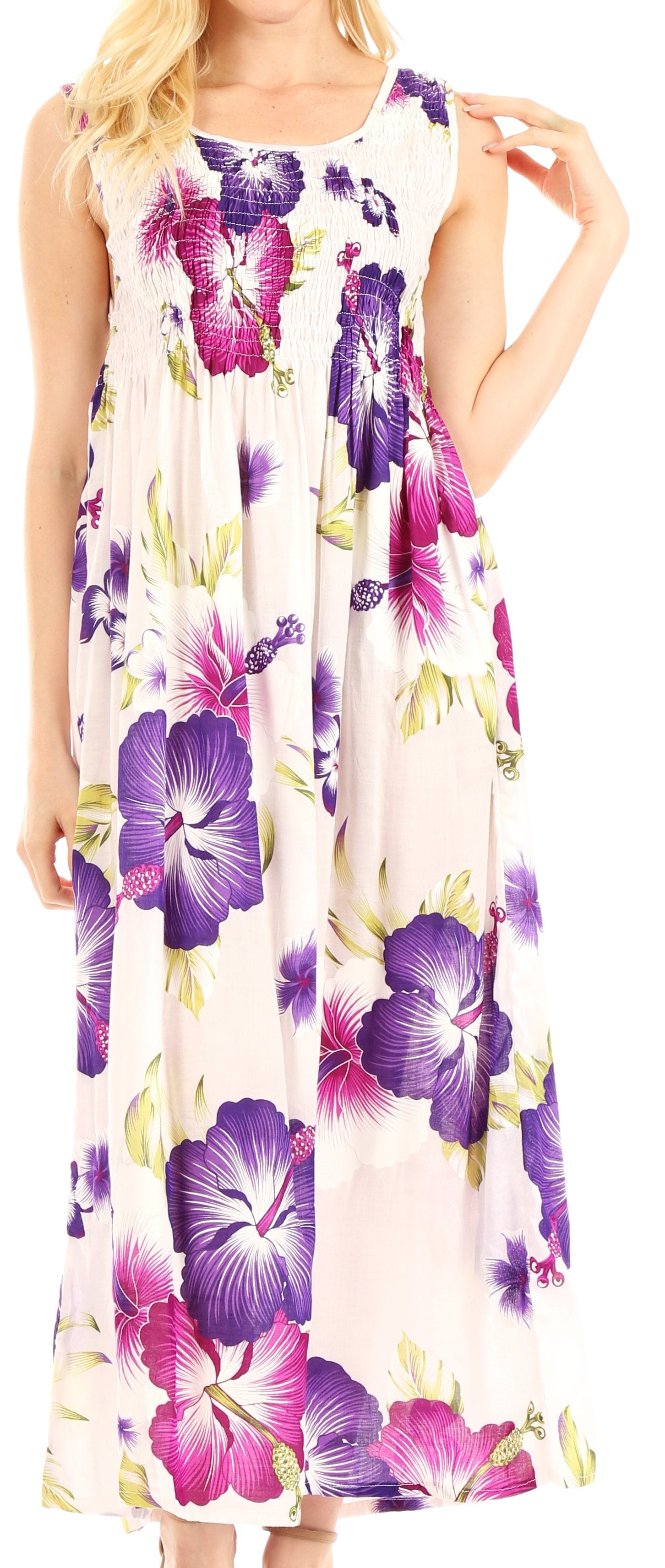 Woman wearing a floral dress with purple and pink flowers on a white background