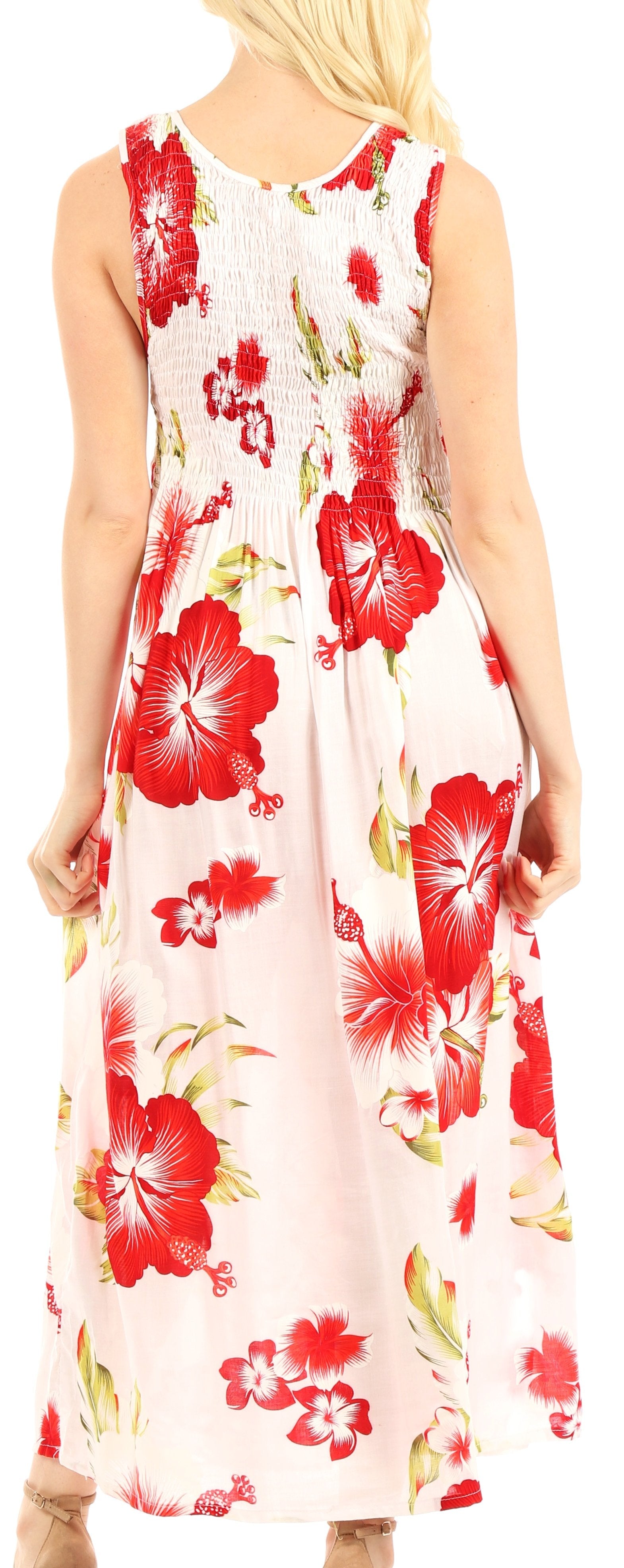 Woman wearing a sleeveless floral dress with red flowers on a white background